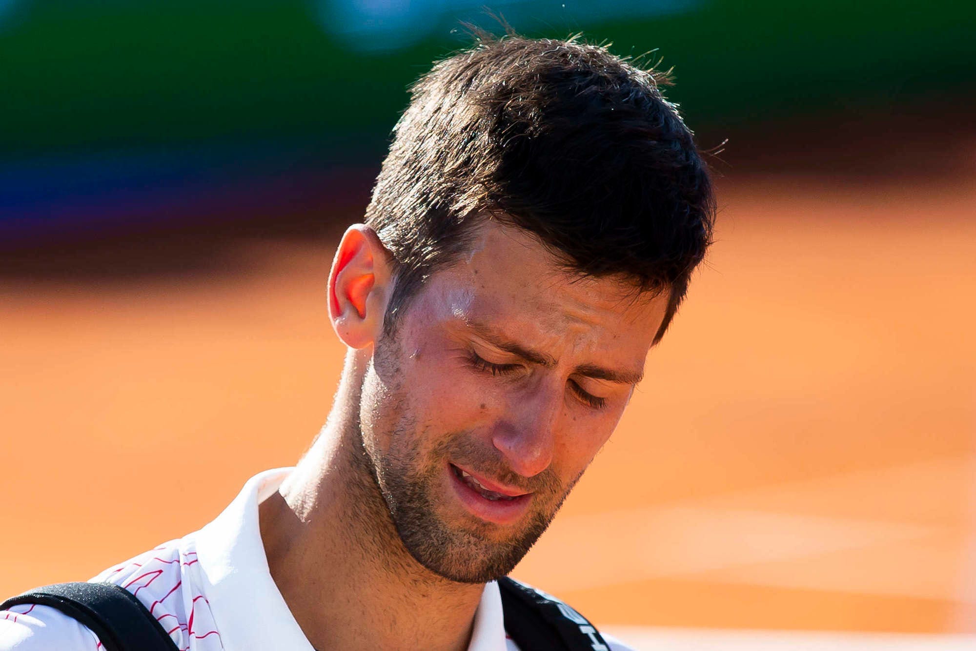 Novak Djokovic of Serbia cries after his match against Alexander Zverev of Germany