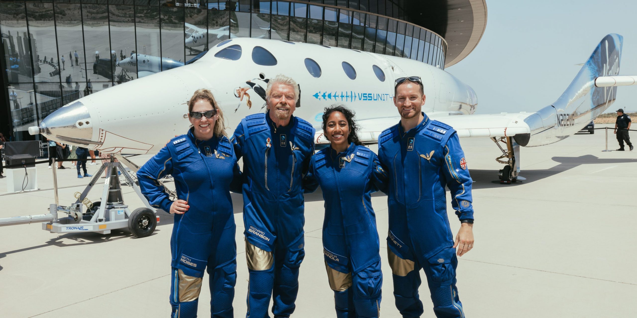 Virgin Galactic founder Richard Branson and the astronauts in front of the spaceship