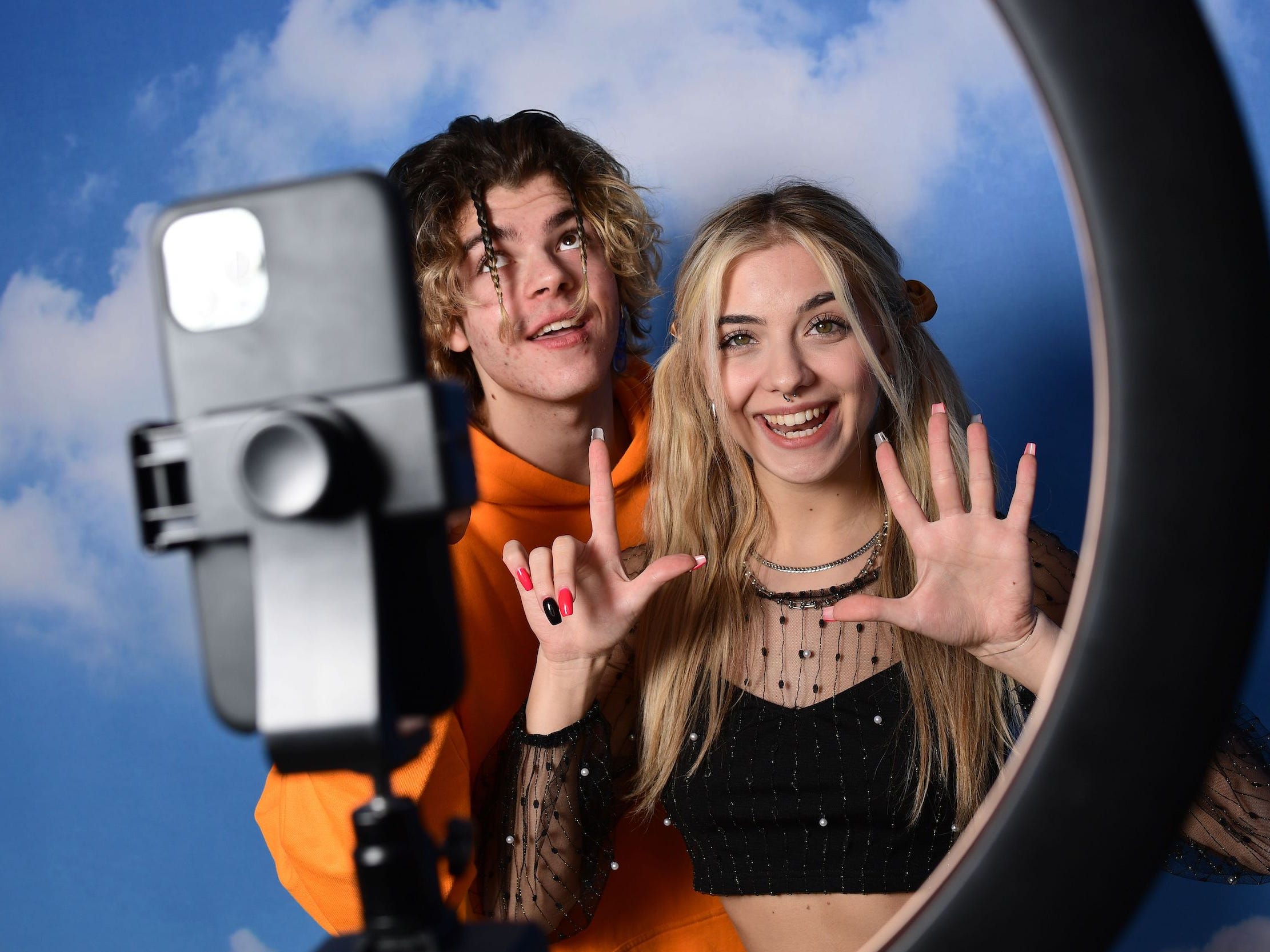 TikTok influencers Florin Vitan (L) and Alessia Lanza perform a video for the social network TikTok in the "Defhouse", a TikTok influencers incubator in Milan, on January 21, 2021.