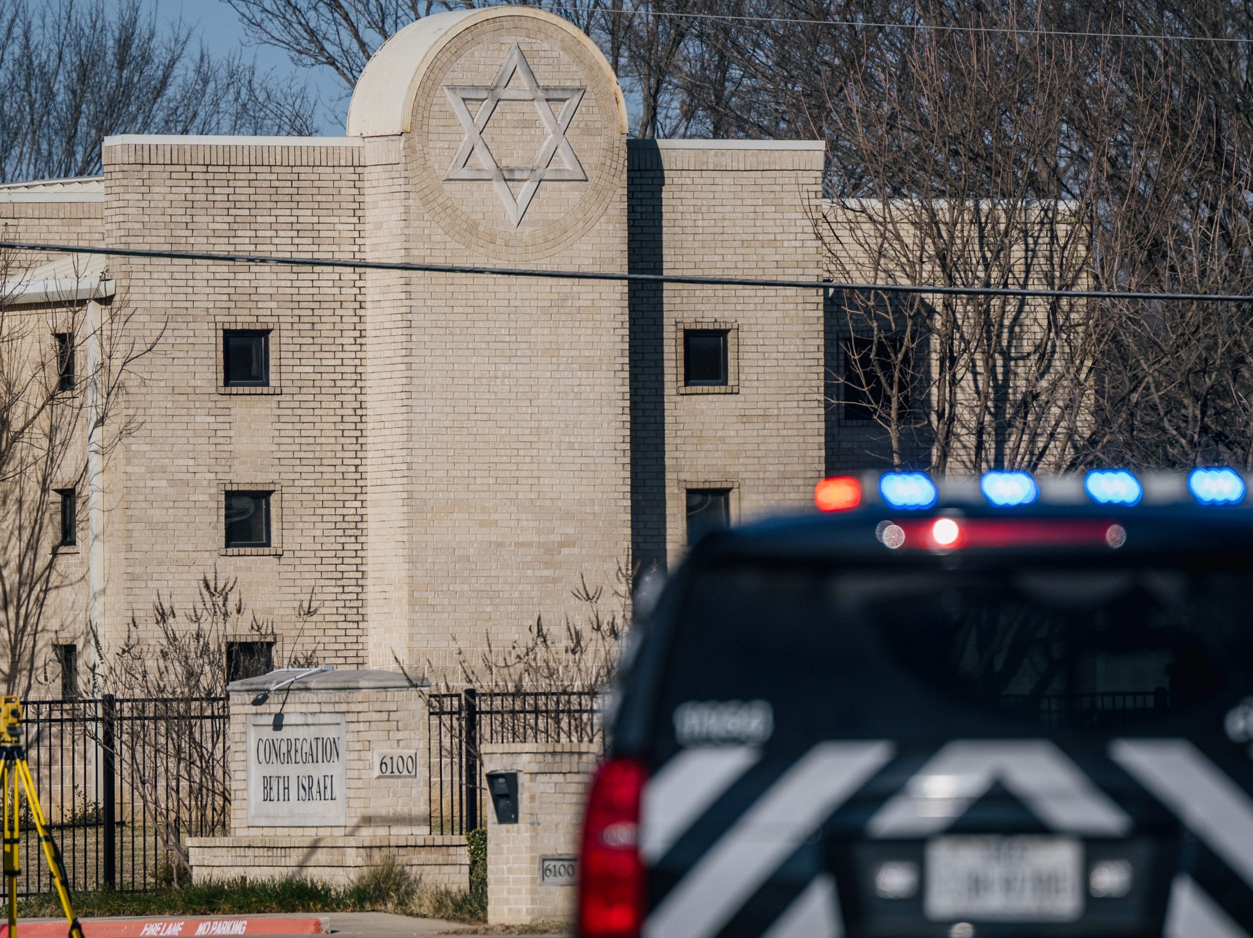 A law enforcement vehicle sits in front of the Congregation Beth Israel synagogue on January 16, 2022 in Colleyville, Texas.