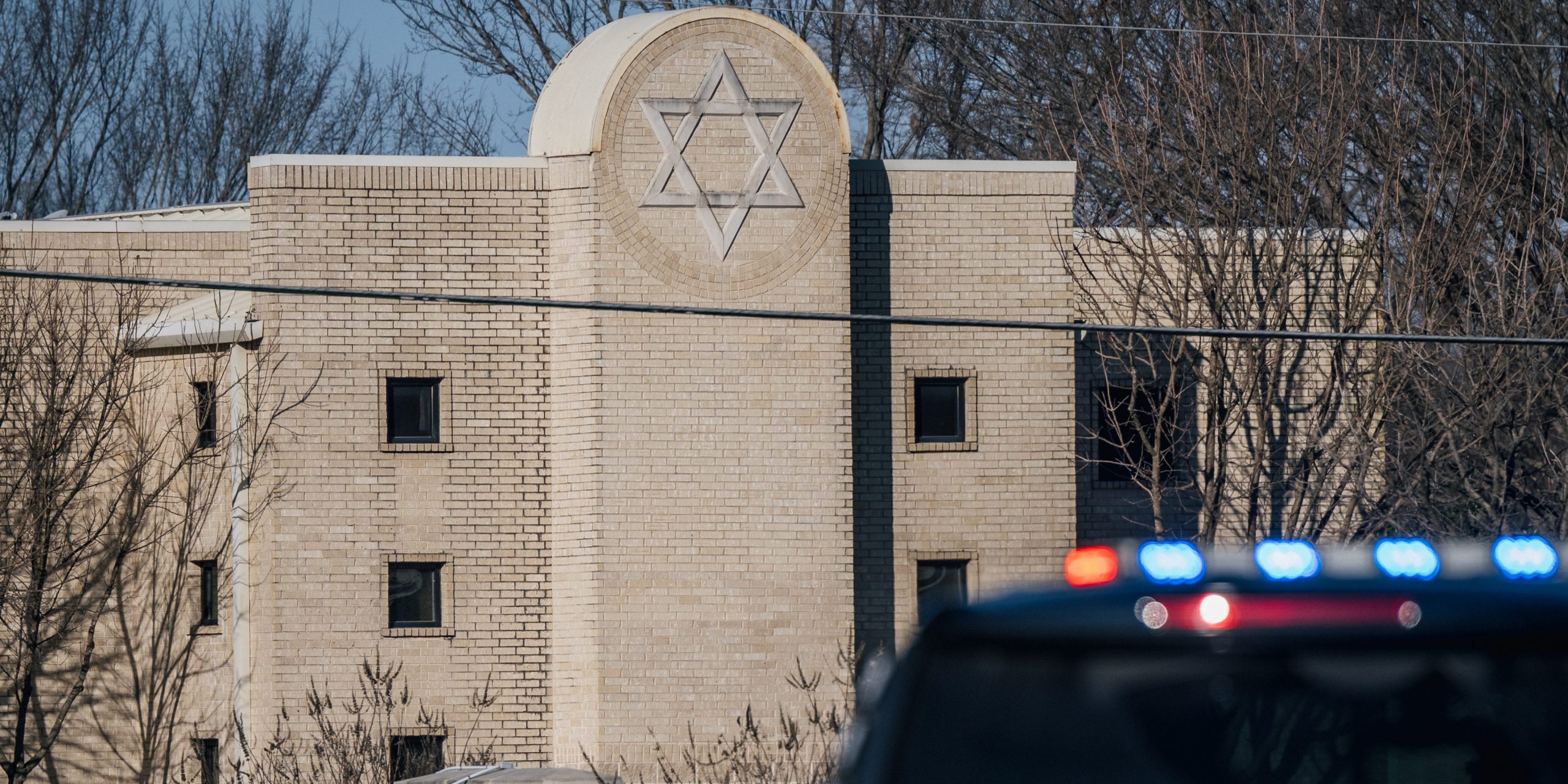 A law enforcement vehicle sits in front of the Congregation Beth Israel synagogue on January 16, 2022 in Colleyville, Texas.
