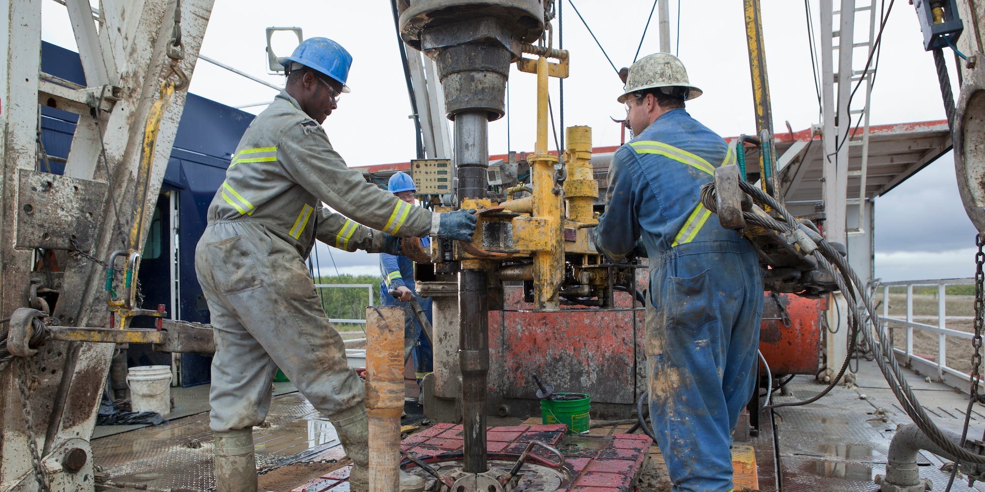 Oil workers drilling for oil on rig