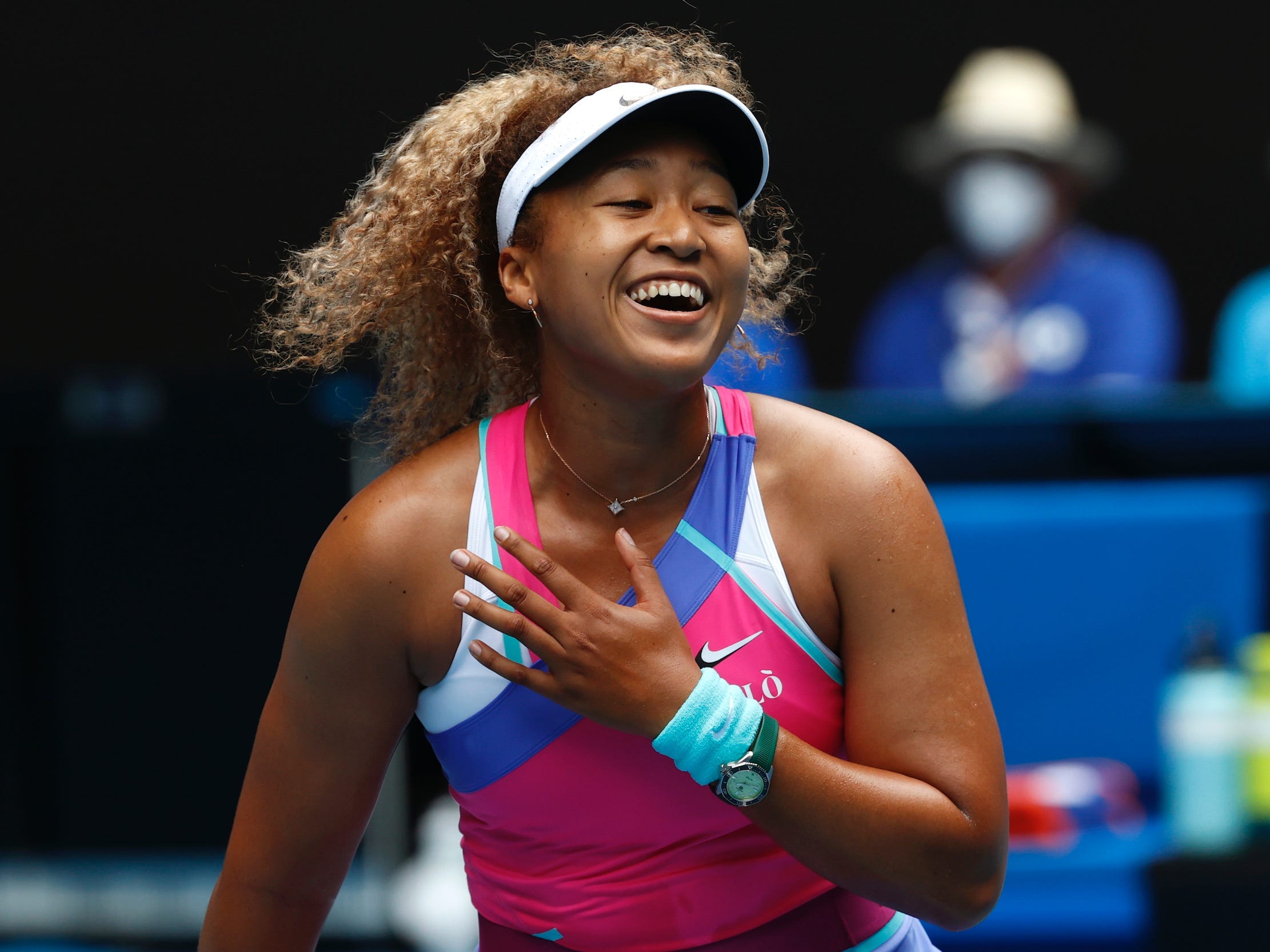 Naomi Osaka laughs.