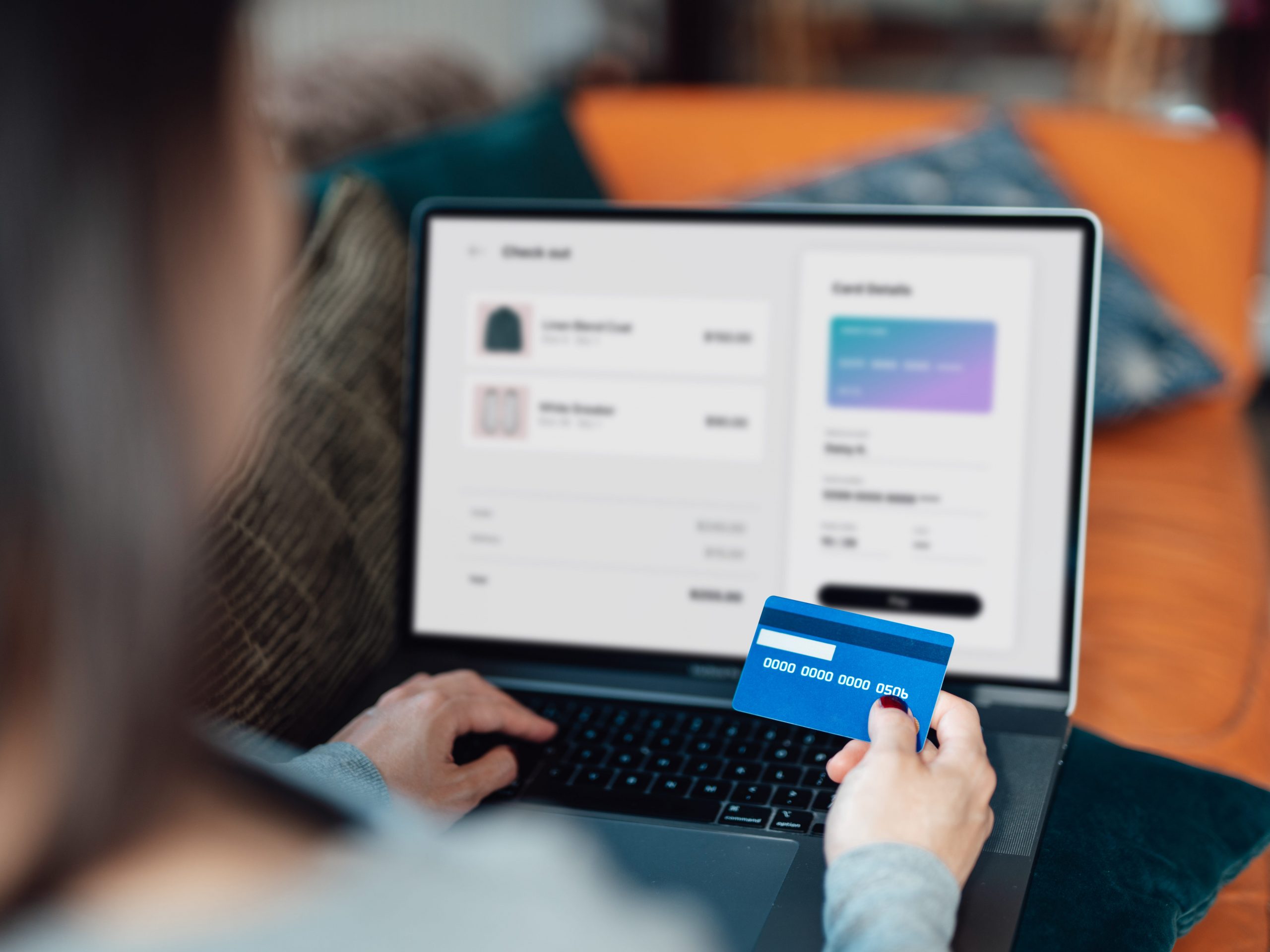 Woman using credit card for online shopping
