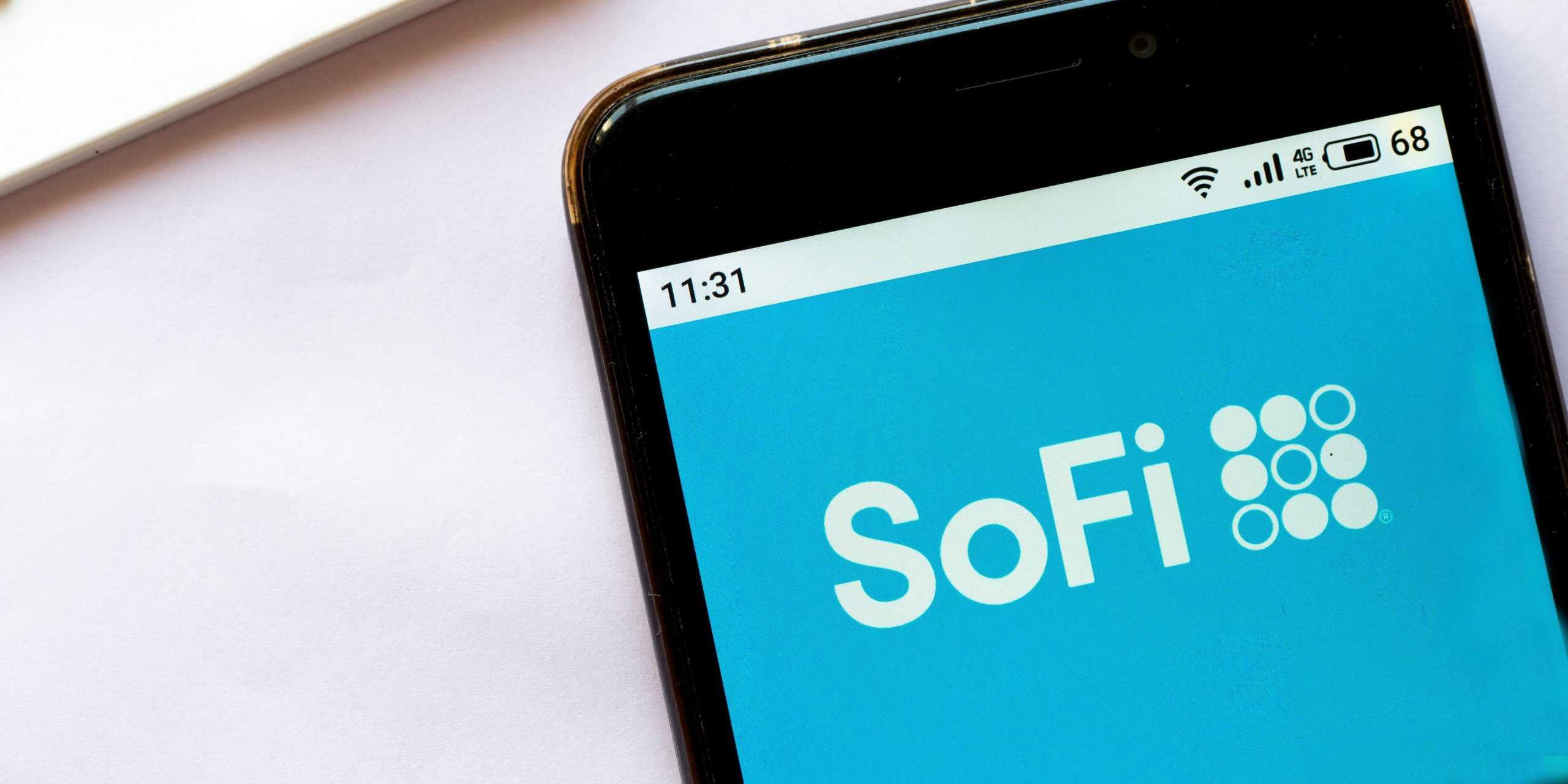 In this photo illustration a SoFi logo seen displayed on a smartphone.