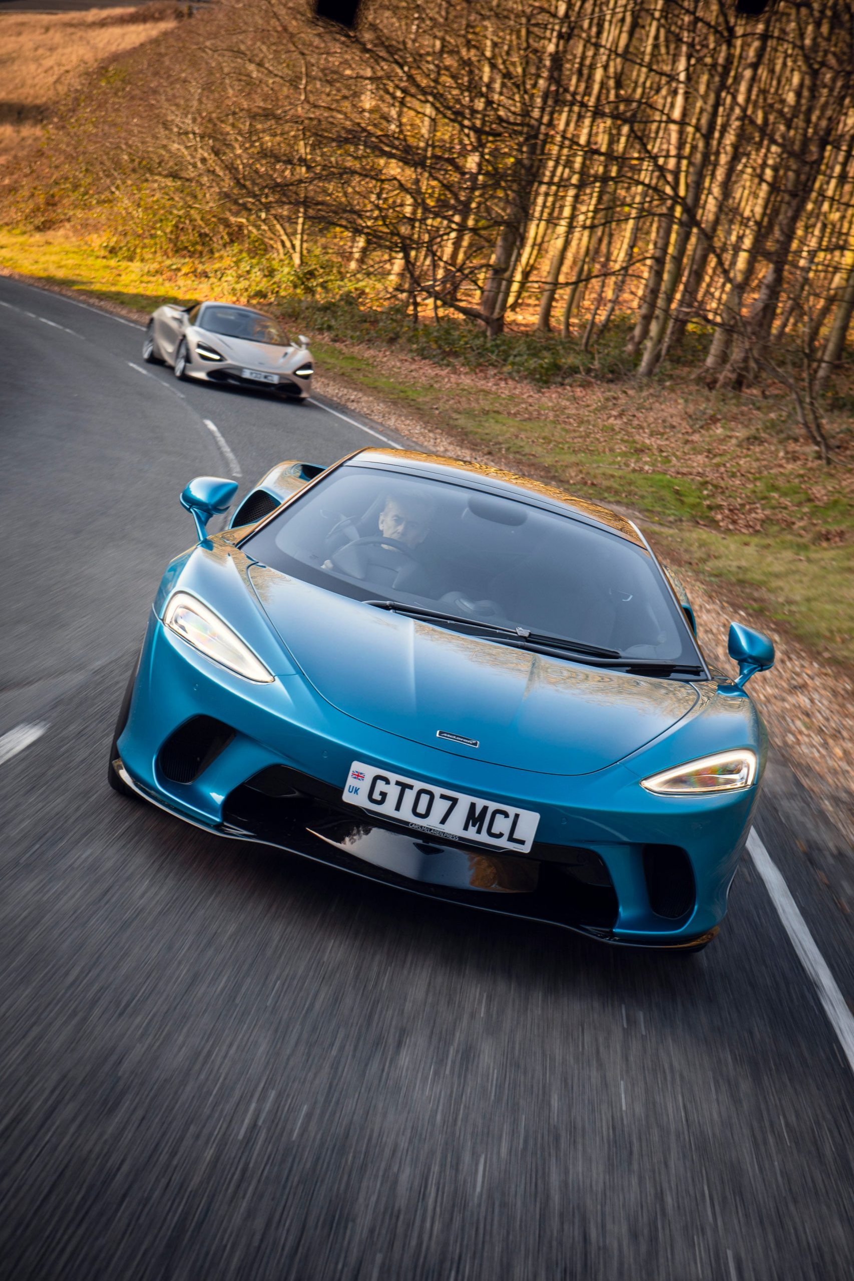 A blue McLaren GT and gray 720-S.