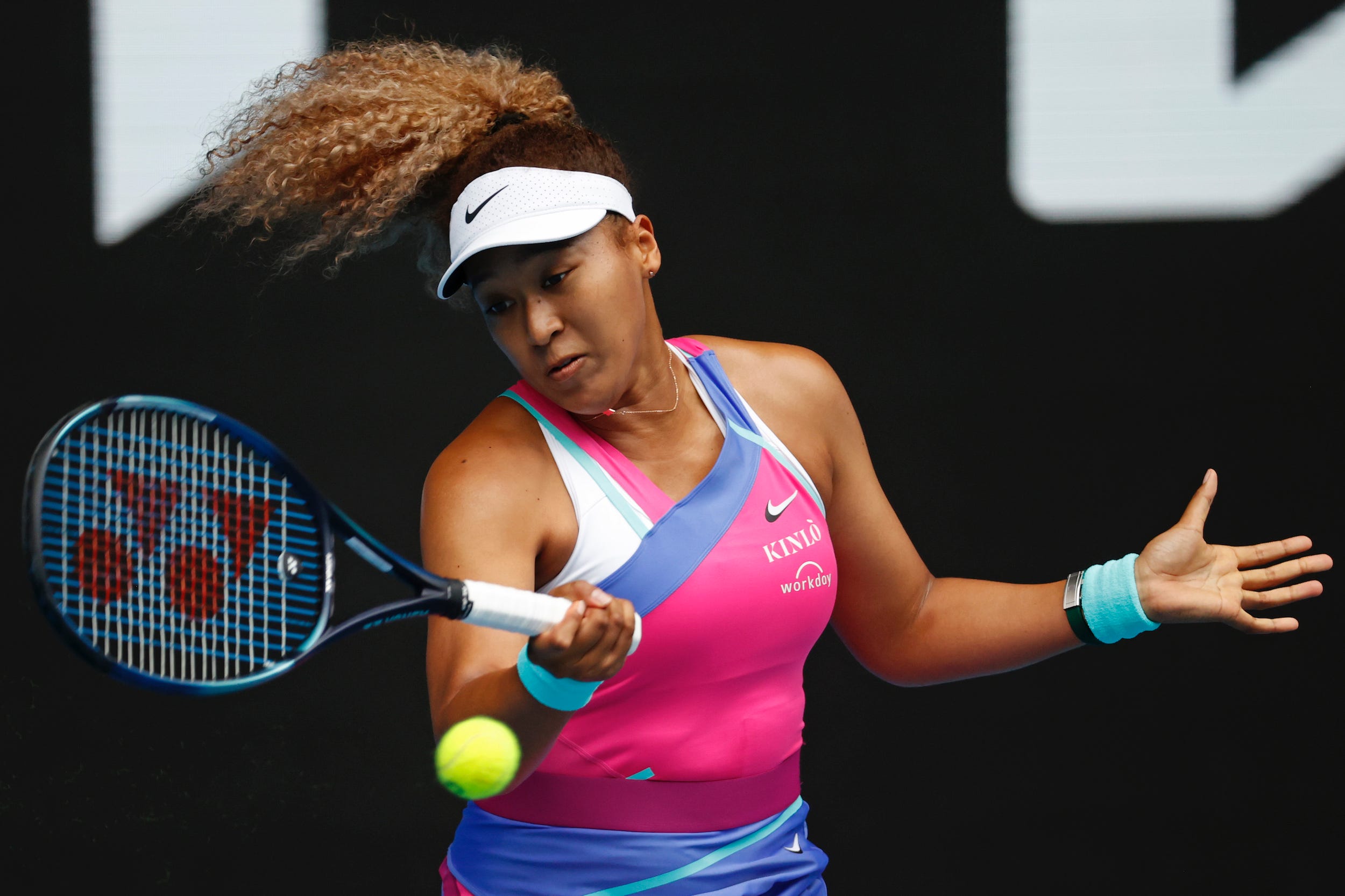 Naomi Osaka hits a forehand.