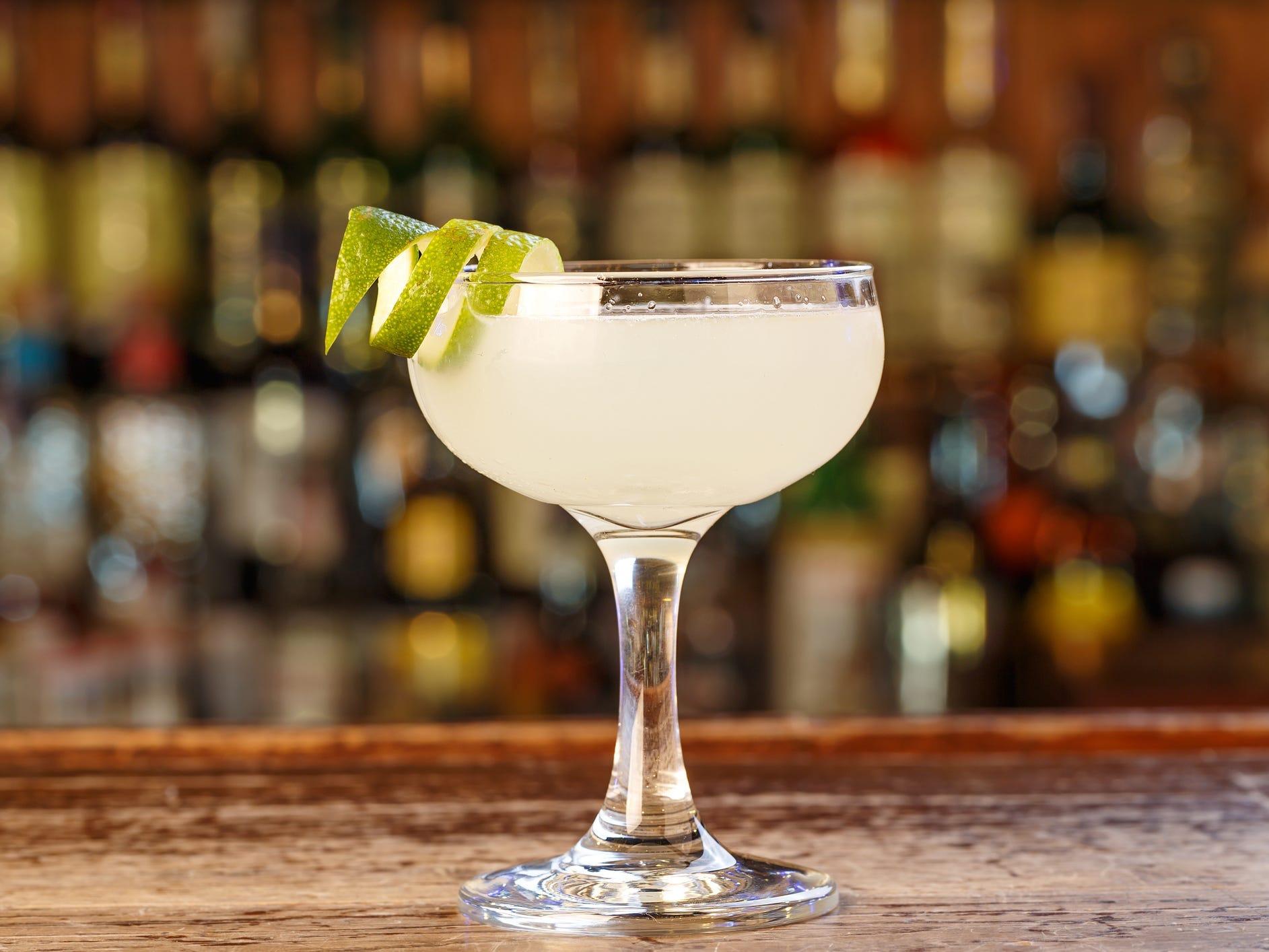 A classic Cuban daiquiri in a coupe glass on a bar