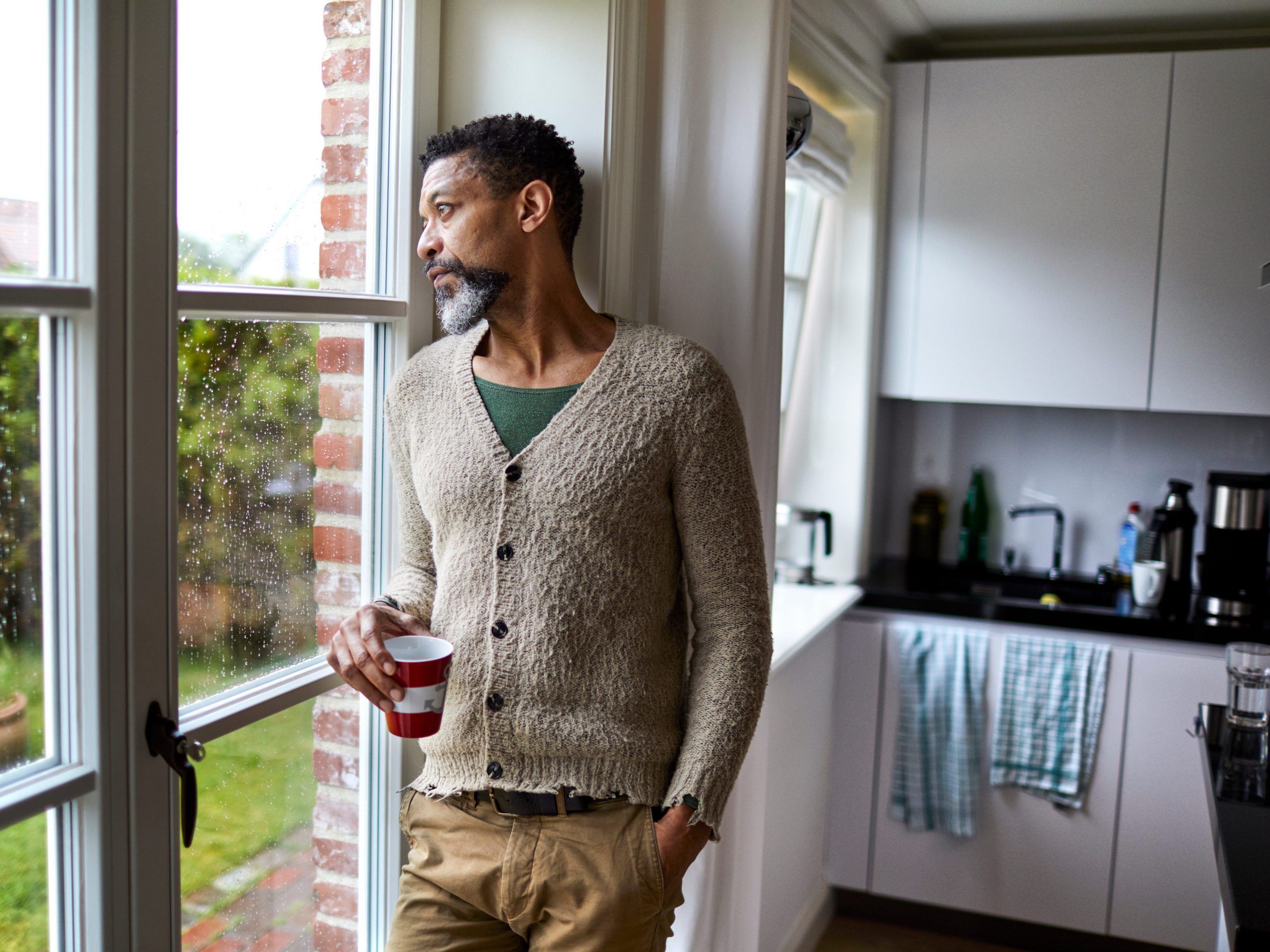 Man standing by window