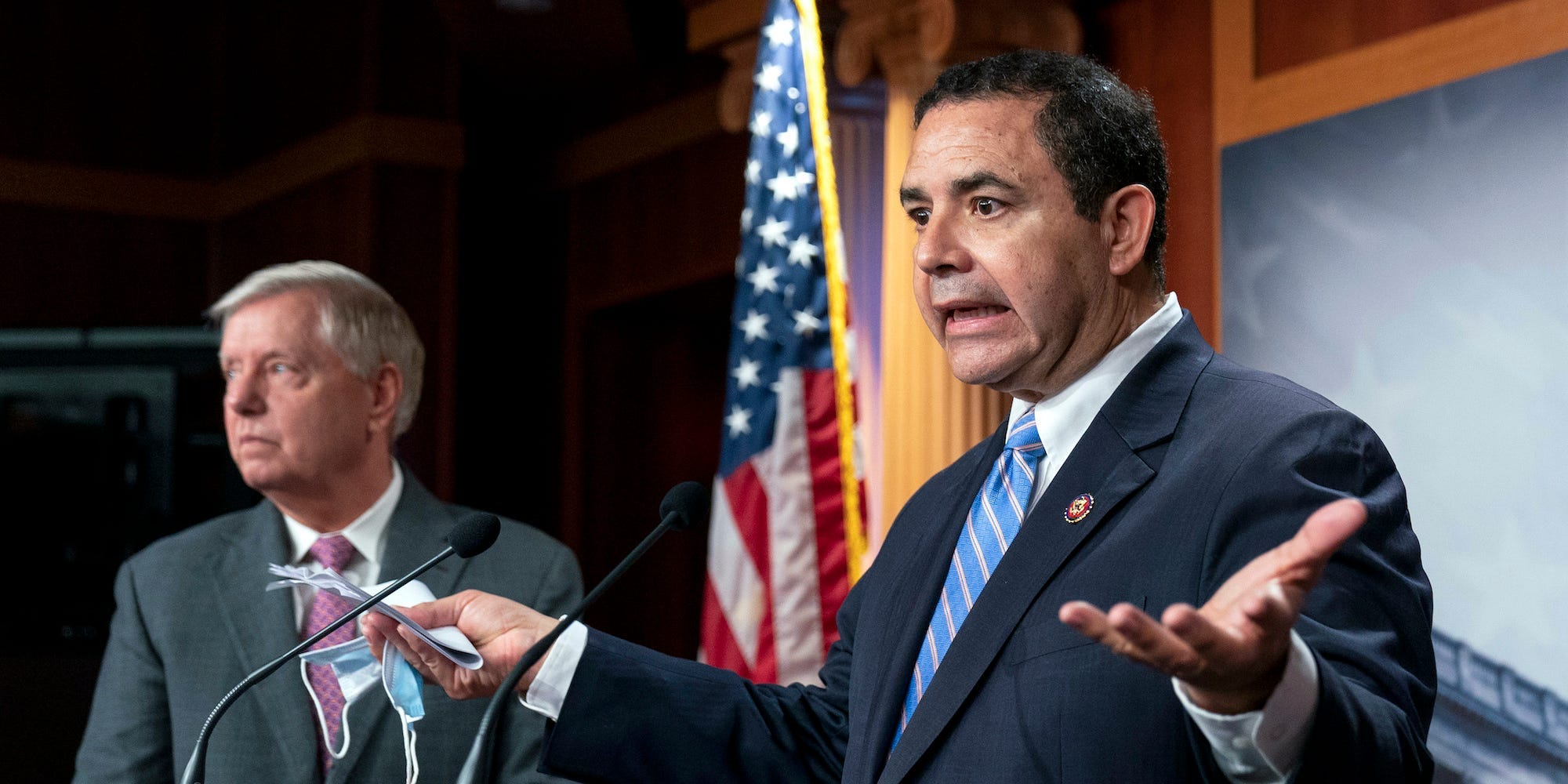 Rep. Henry Cuellar, D-Texas, with Sen. Lindsey Graham, R-S.C., speaks about the United States-Mexico border during a news conference at the Capitol in Washington, Friday, July 30, 2021