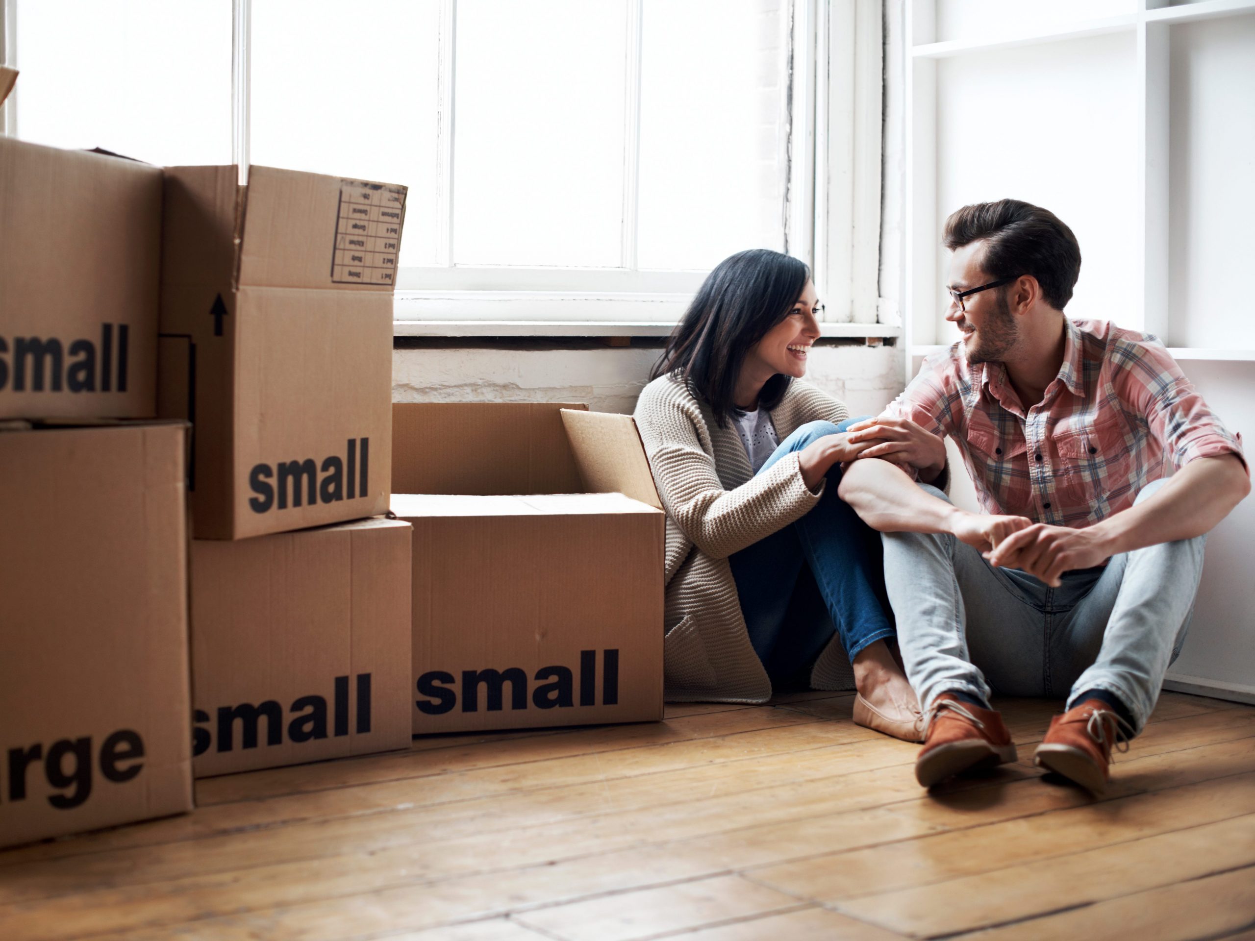 Couple moving into new flat.