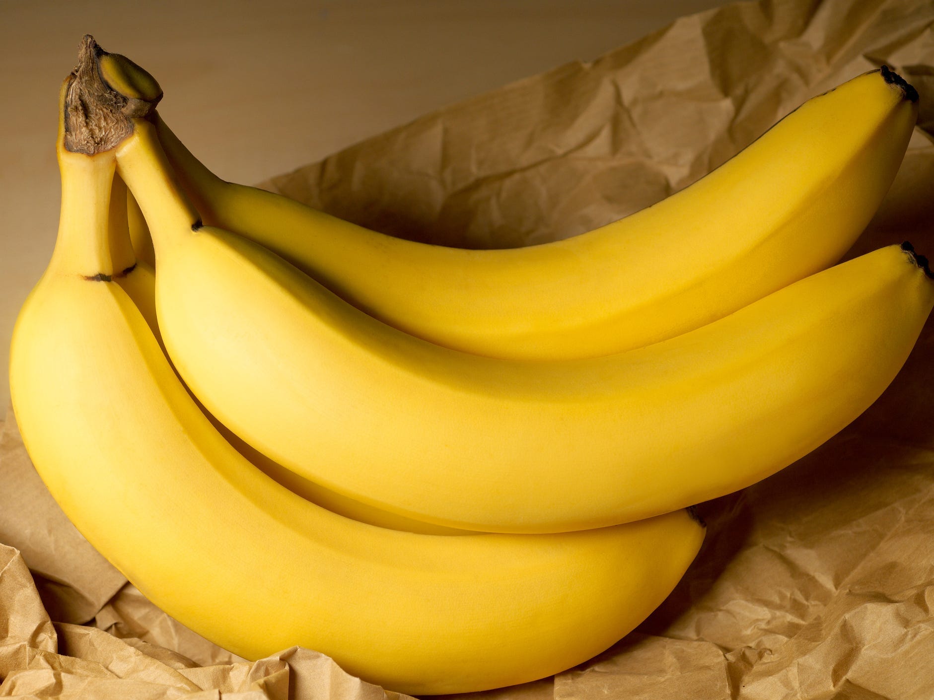 Bananas on a brown paper bag