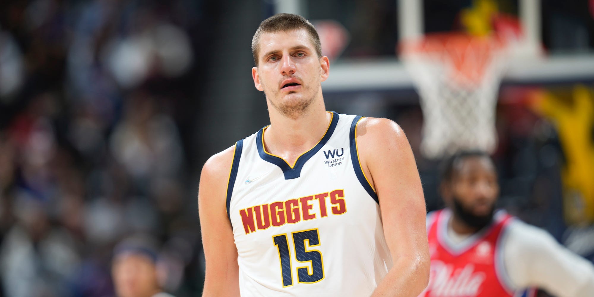 Nikola Jokic walks down the court during a game.