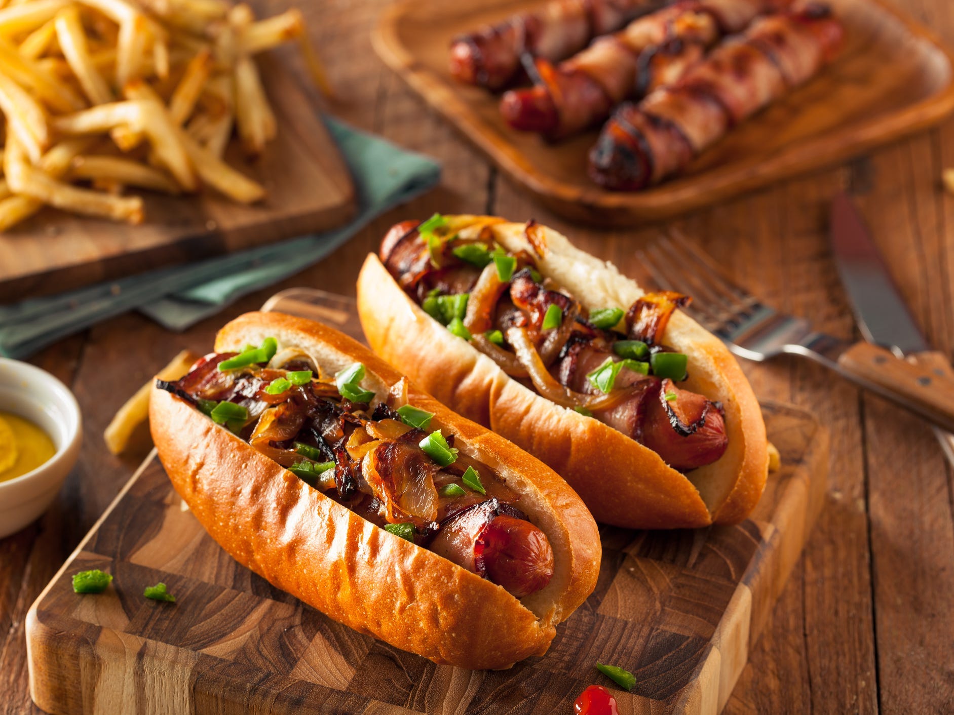 Bacon wrapped hot dogs with loaded toppings