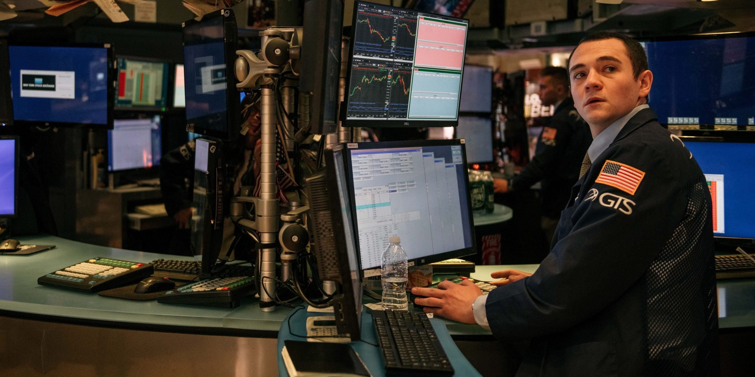 Traders work through the closing minutes of trading Tuesday on the New York Stock Exchange floor on February 25, 2020 in New York City.