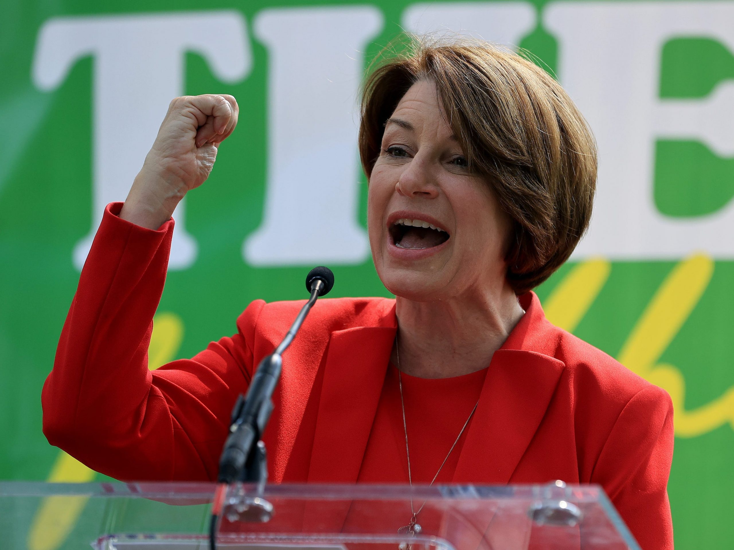 Senator Amy Klobuchar poses triumphantly.
