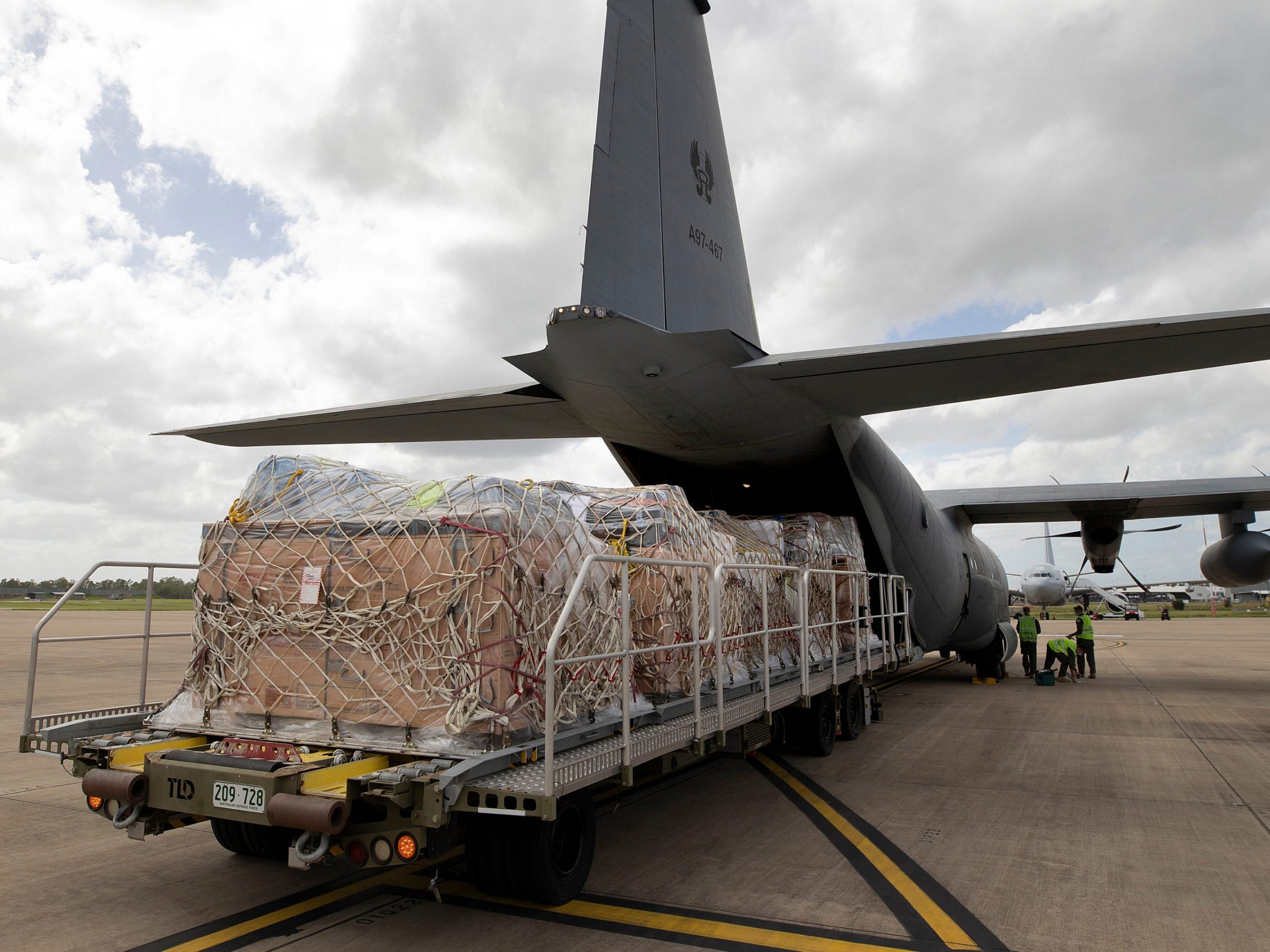 A C-130J Hercules aircraft bound for Tonga is loaded with humanitarian assistance and supplies at RAAF Base Amberley, Australia, Friday, Jan. 21, 2022.