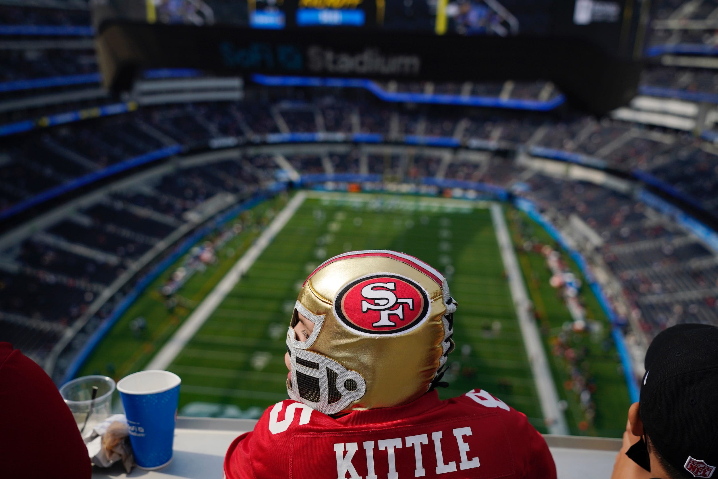 A San Francisco 49ers fans takes in a game at SoFi Stadium.