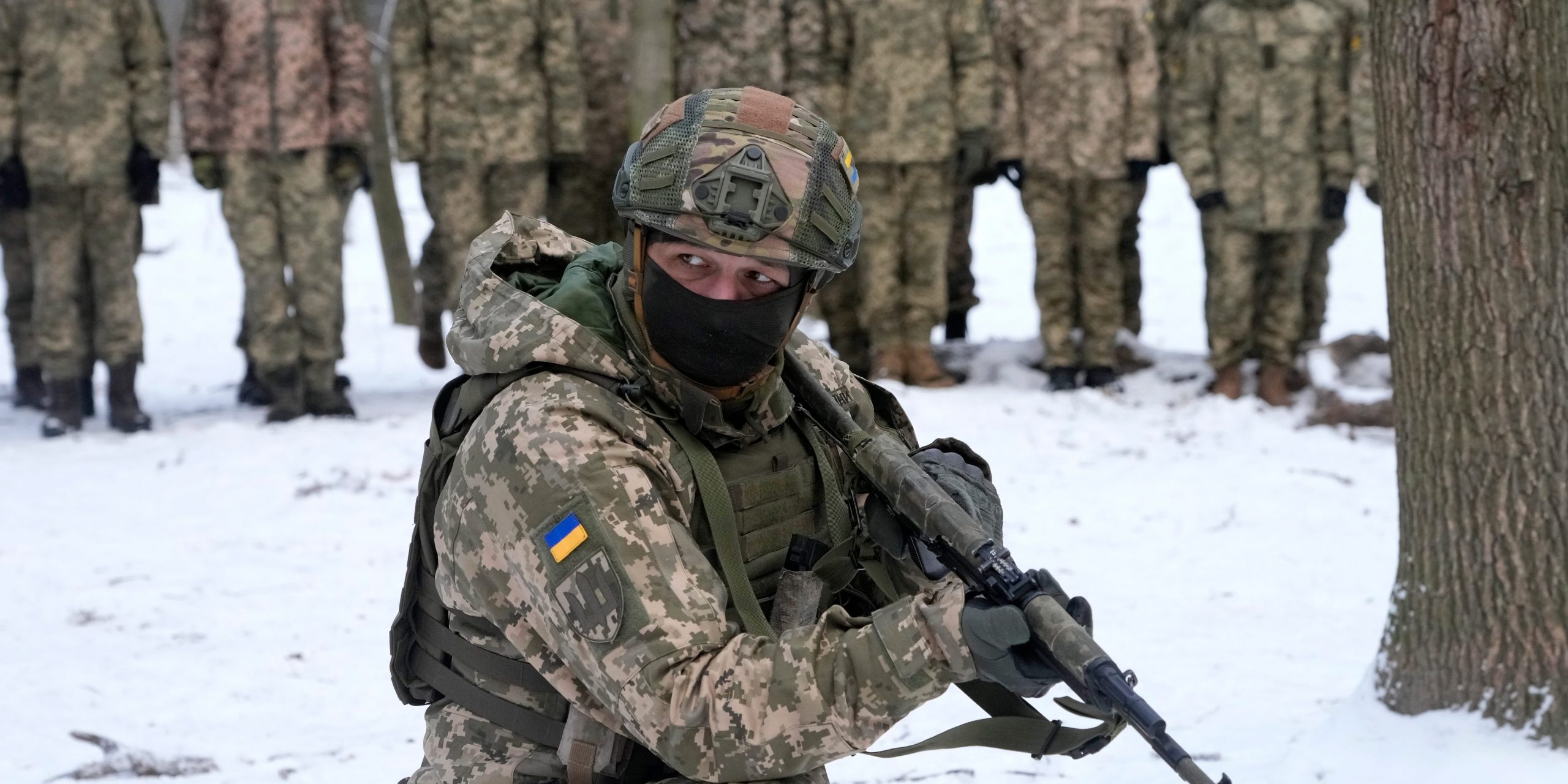 An instructor trains members of Ukraine's Territorial Defense Forces, volunteer military units of the Armed Forces, in a city park in Kyiv, Ukraine, Saturday, Jan. 22, 2022.