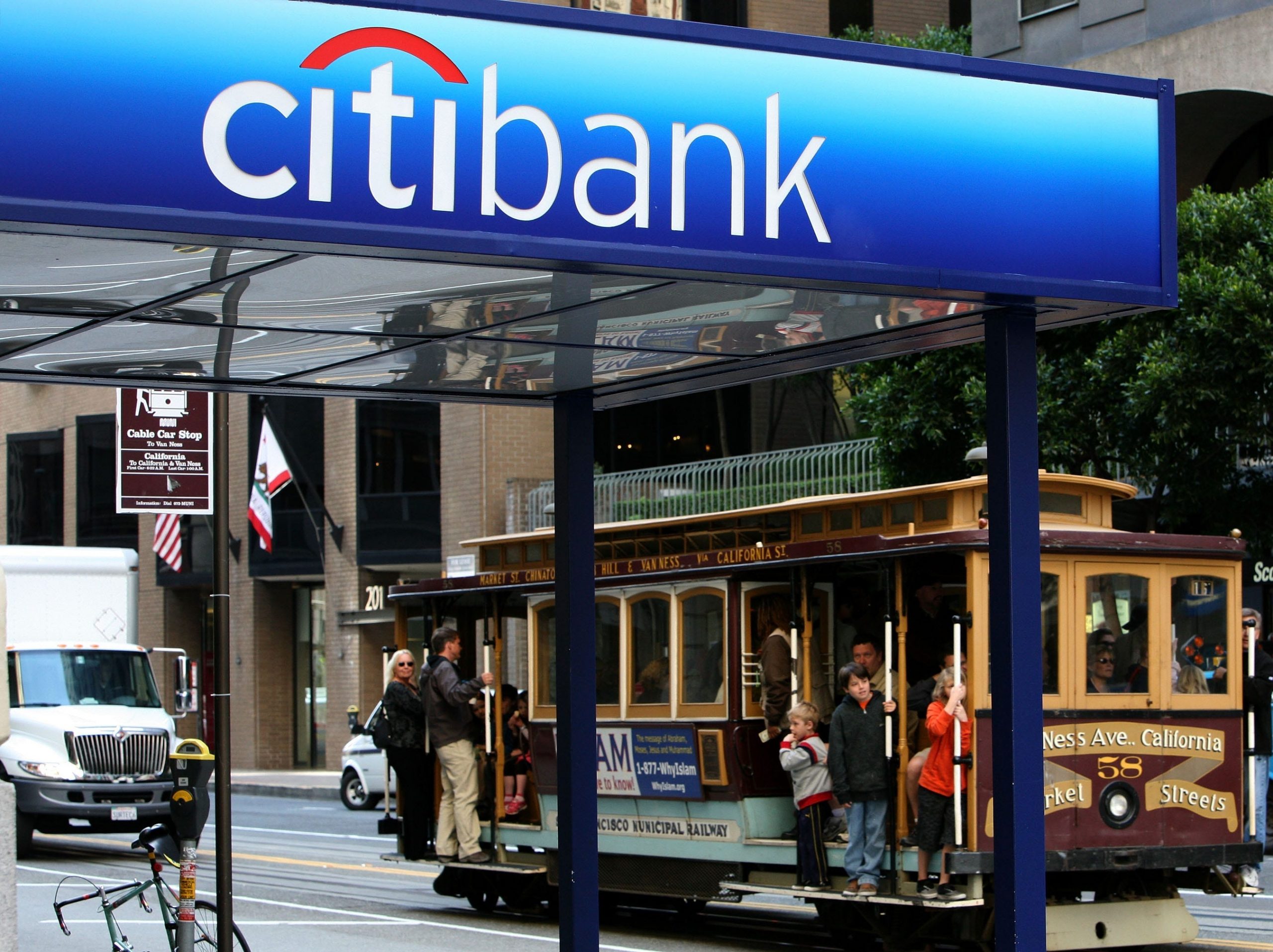 A cable car passes a Citibank branch office April 17, 2009 in San Francisco, California.