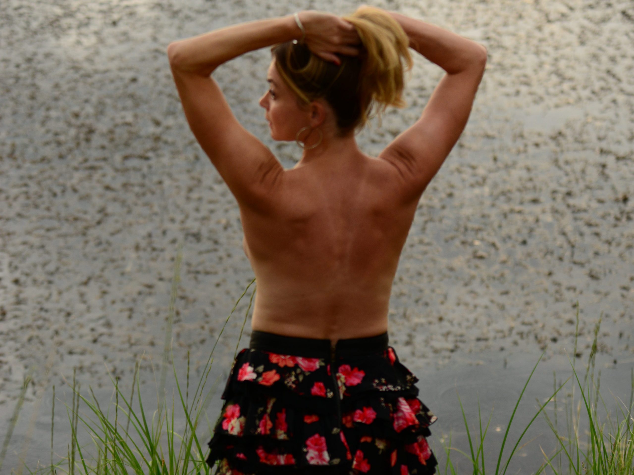 Amanda posing by a lake