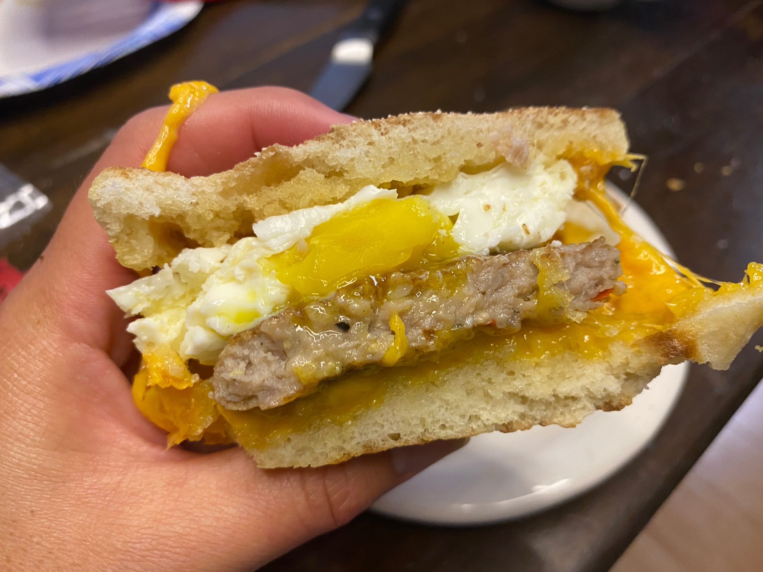 The sausage-and-egg sandwich was delicious.