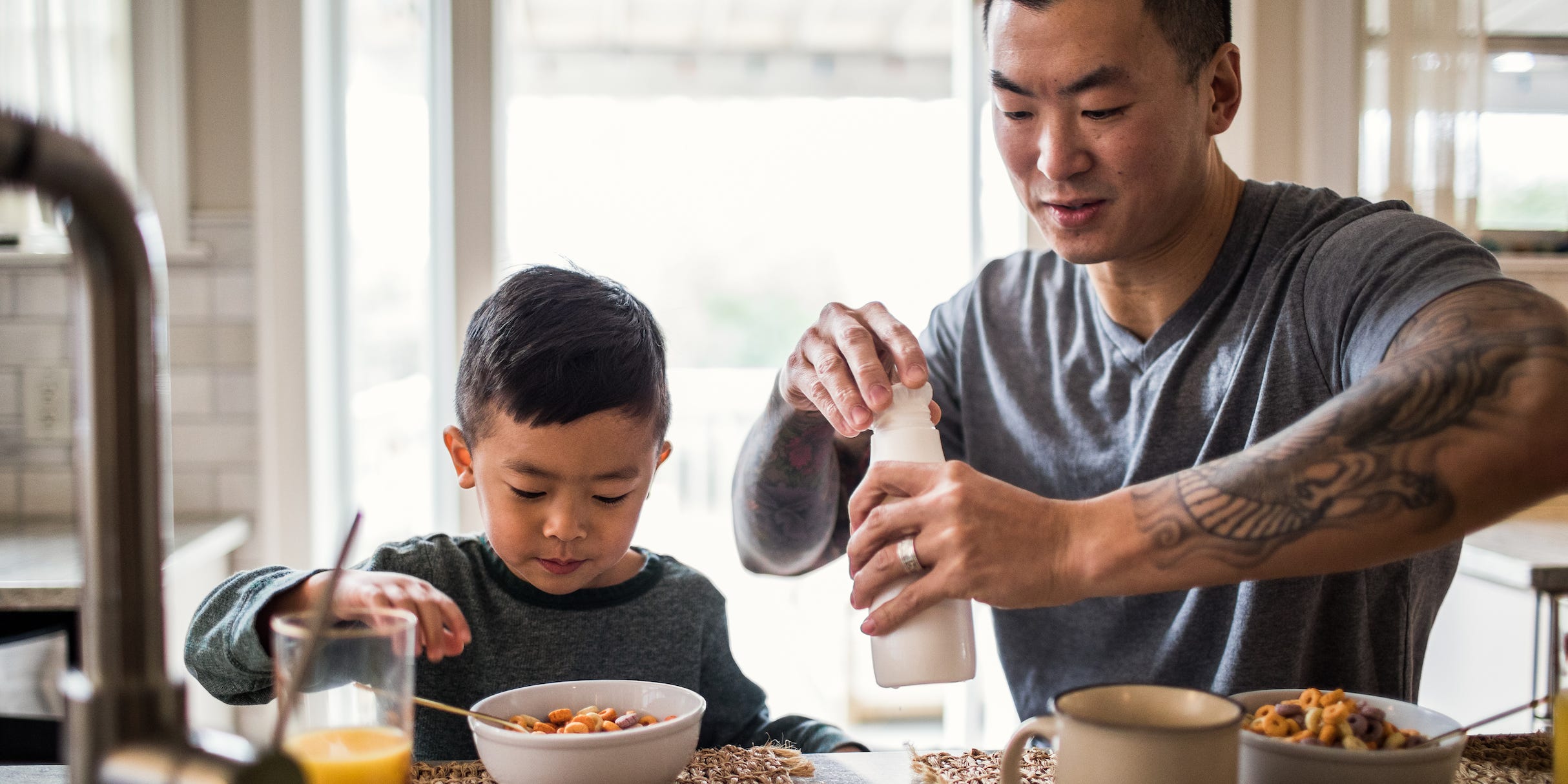 A father and son eat a calcium-rich breakfast.