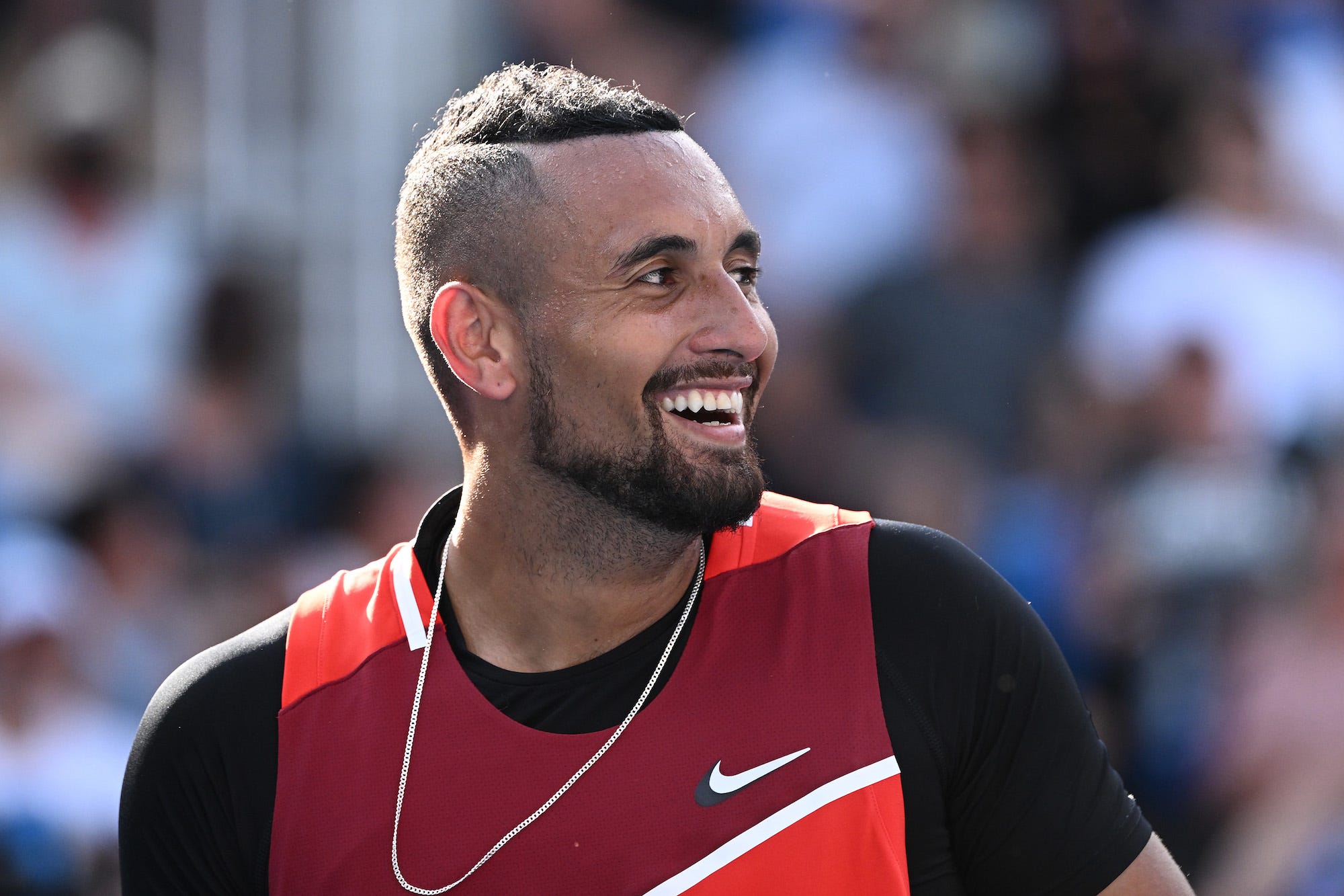Nick Kyrgios of Australia rea in his third round doubles match with Thanasi Kokkinakis of Australia against Ariel Behar of Uruguay and Gonzalo Escobar of Ecuador during day seven of the 2022 Australian Open at Melbourne Park