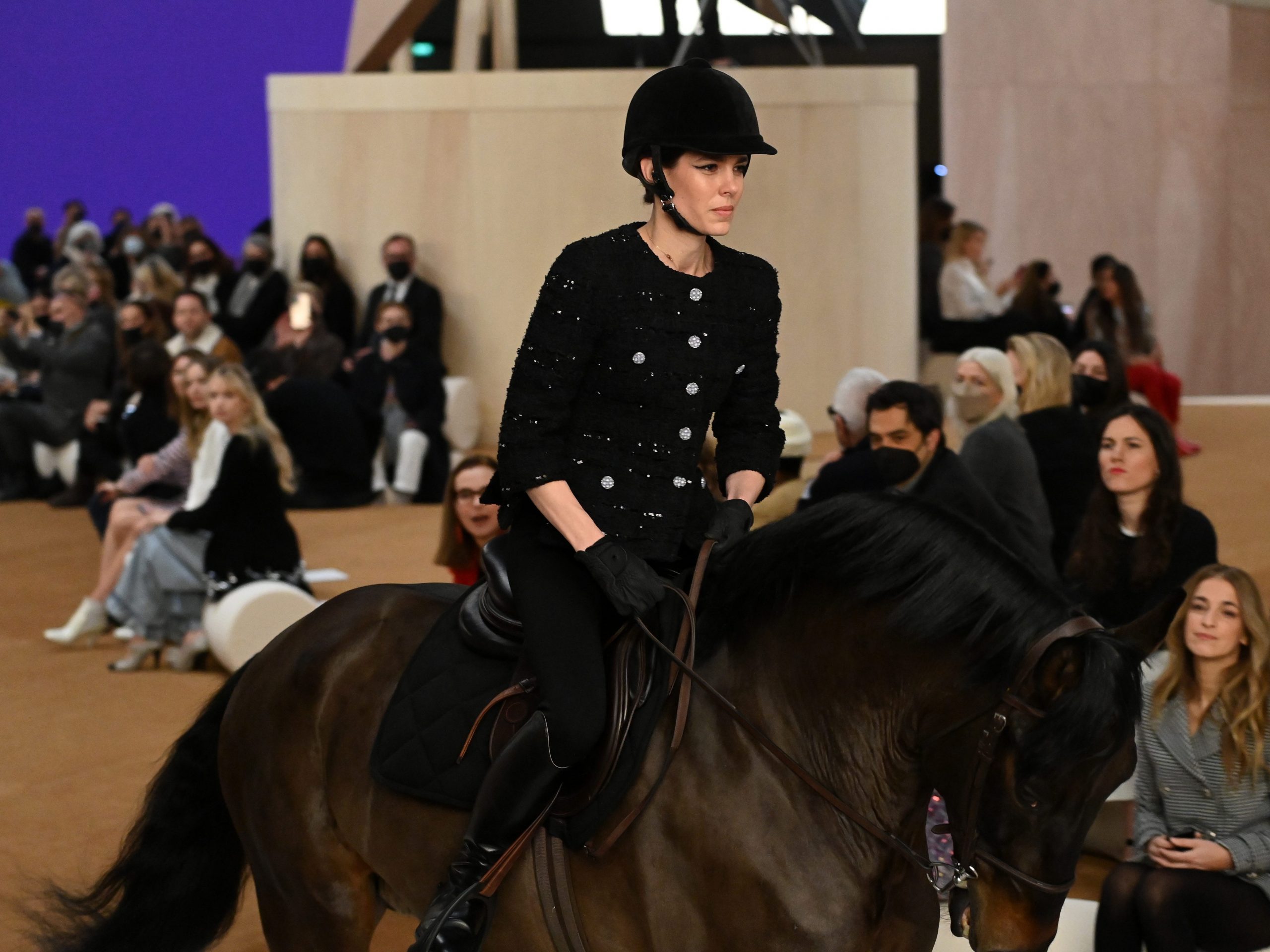 Charlotte Casiraghi rides a horse on the runway during the Chanel Haute Couture Spring/Summer 2022 show as part of Paris Fashion Week at Le Grand Palais Ephemere on January 25, 2022 in Paris, Franc