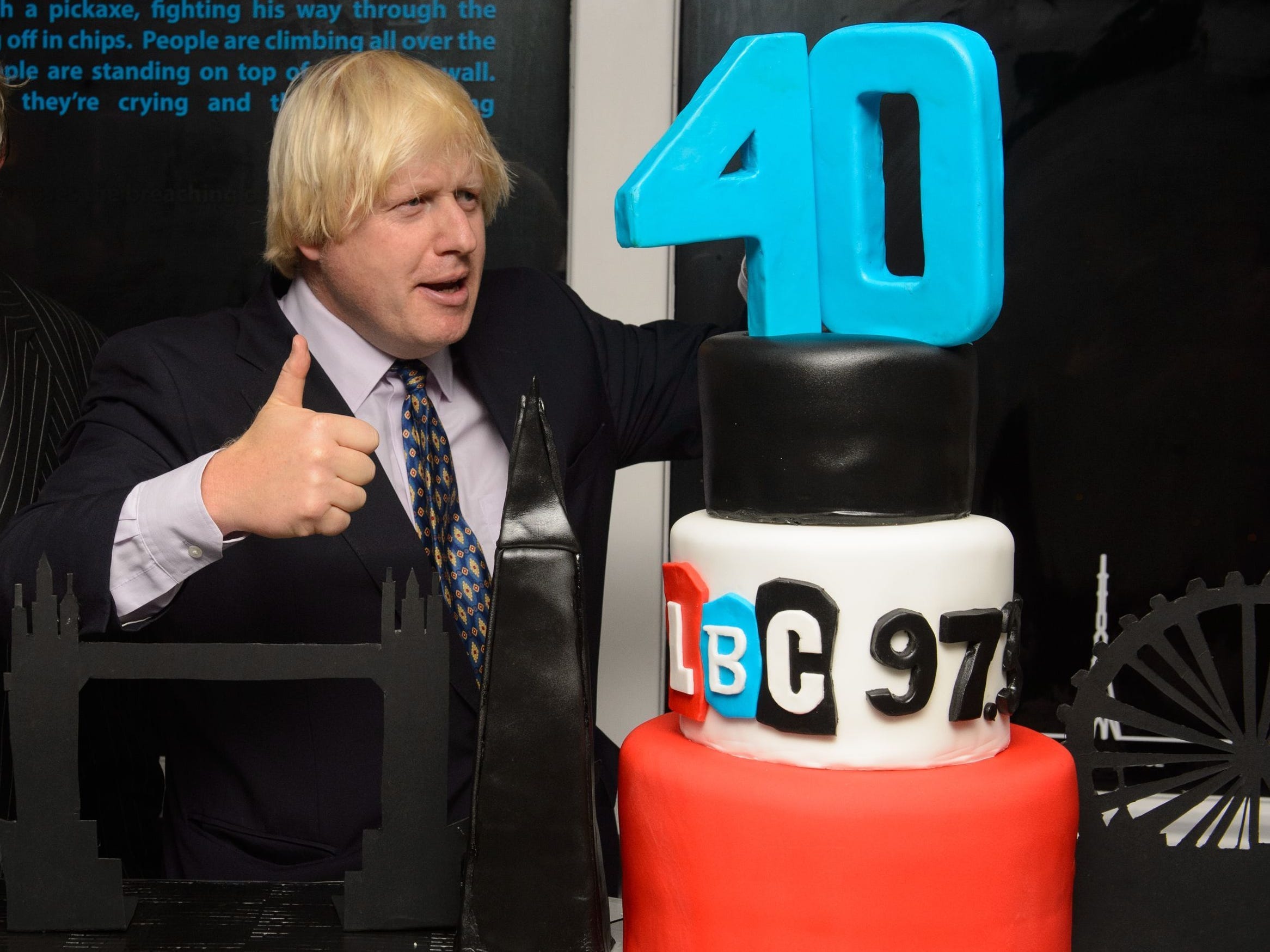 Boris Johnson stood next to Nick Ferrari with a cake marking LBC's 40th anniversary