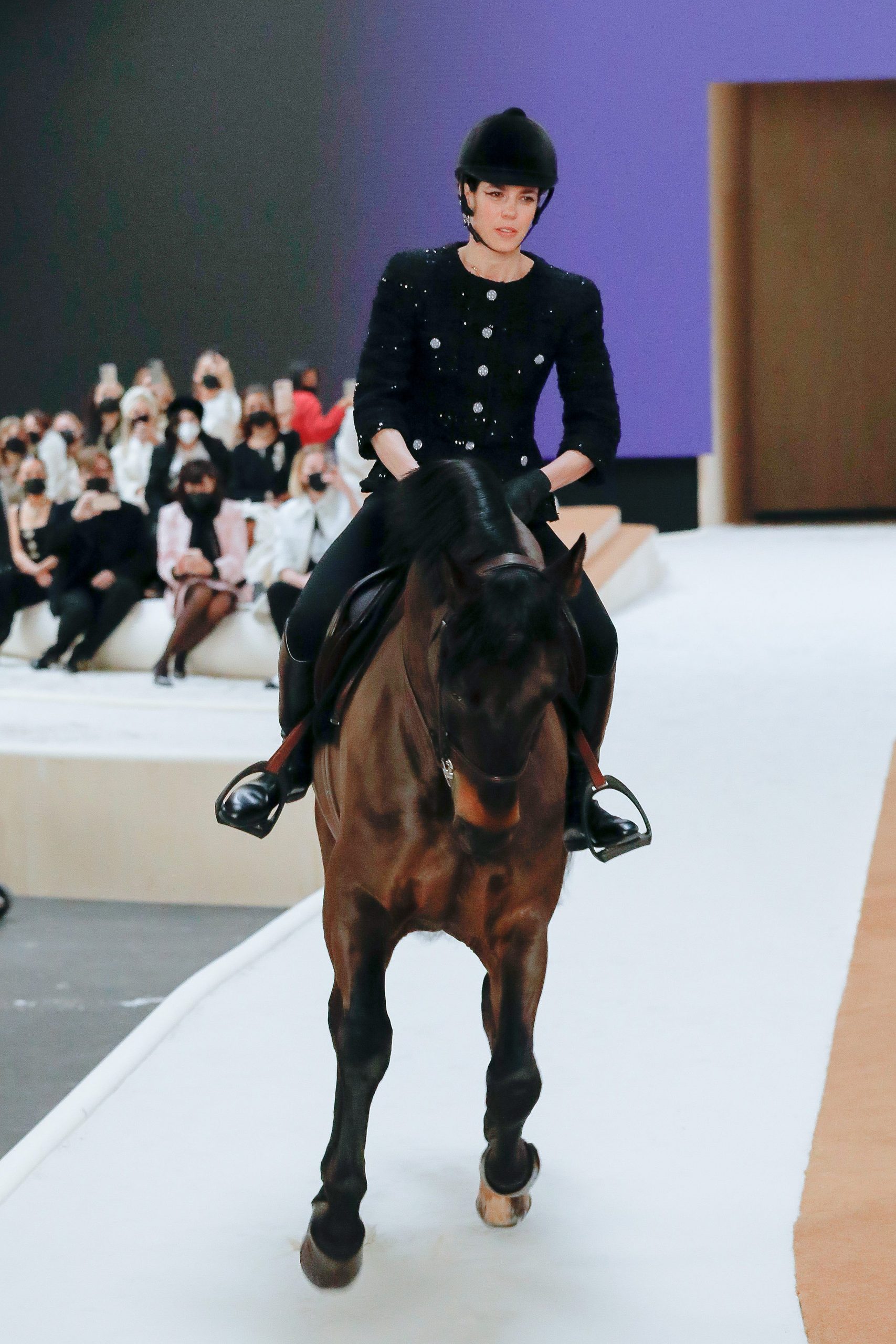 Charlotte Casiraghi rides a horse on the runway during the Chanel Haute Couture Spring/Summer 2022 show as part of Paris Fashion Week at Le Grand Palais Ephemere on January 25, 2022 in Paris, France.