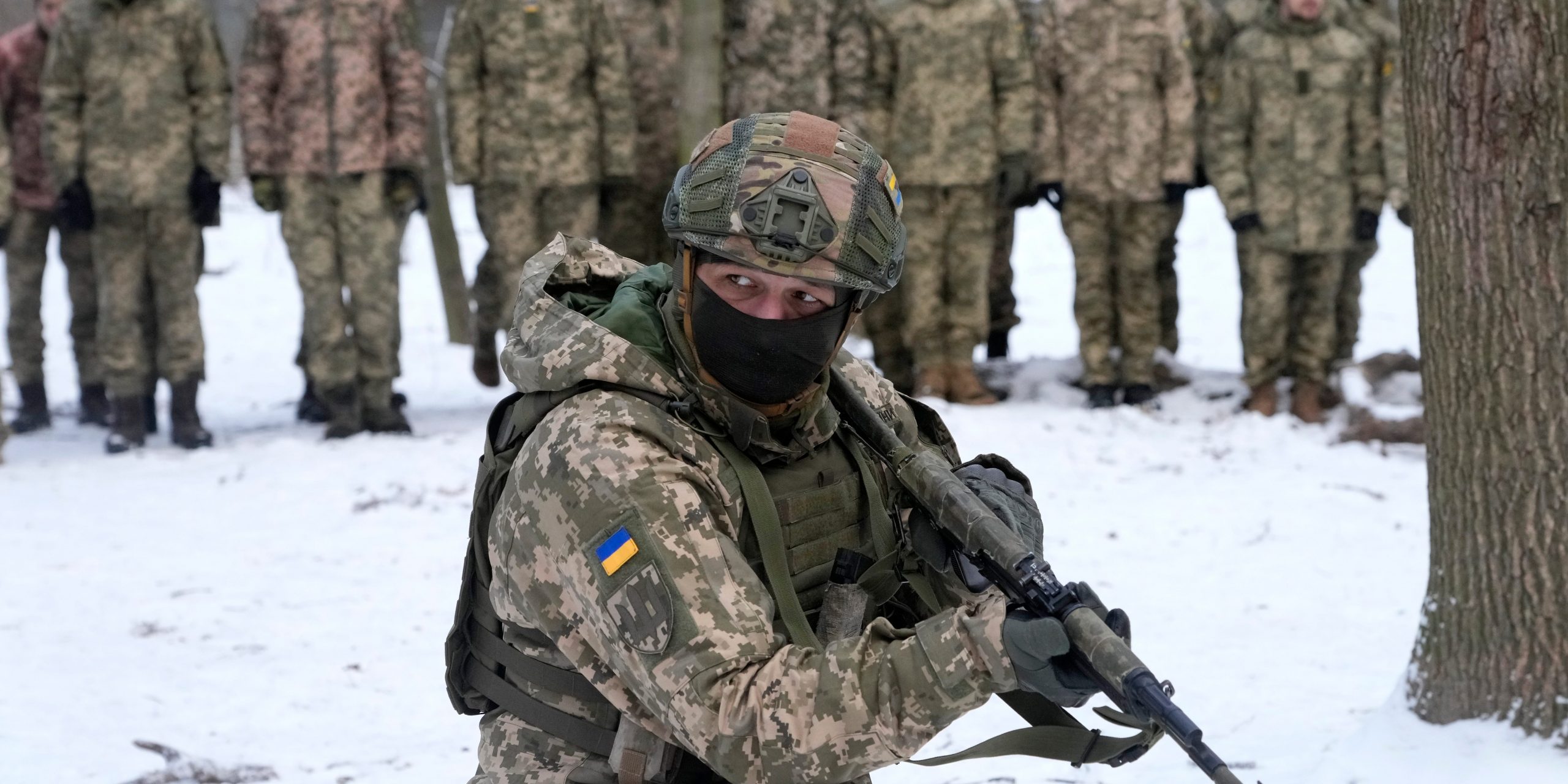 An instructor trains members of Ukraine's Territorial Defense Forces, volunteer military units of the Armed Forces, in a city park in Kyiv, Ukraine, Saturday, Jan. 22, 2022.