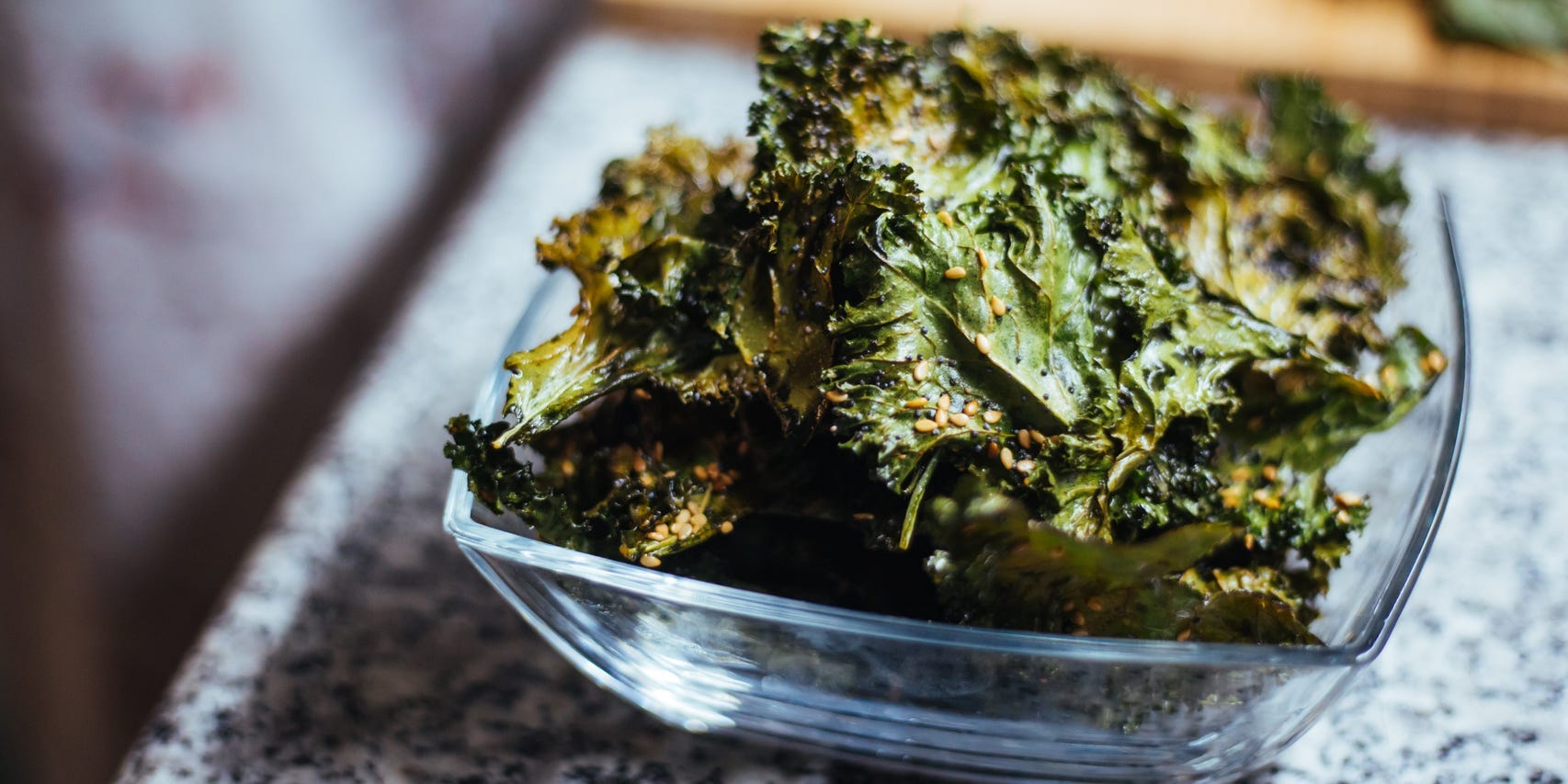 kale chips in a bowl on a countertop