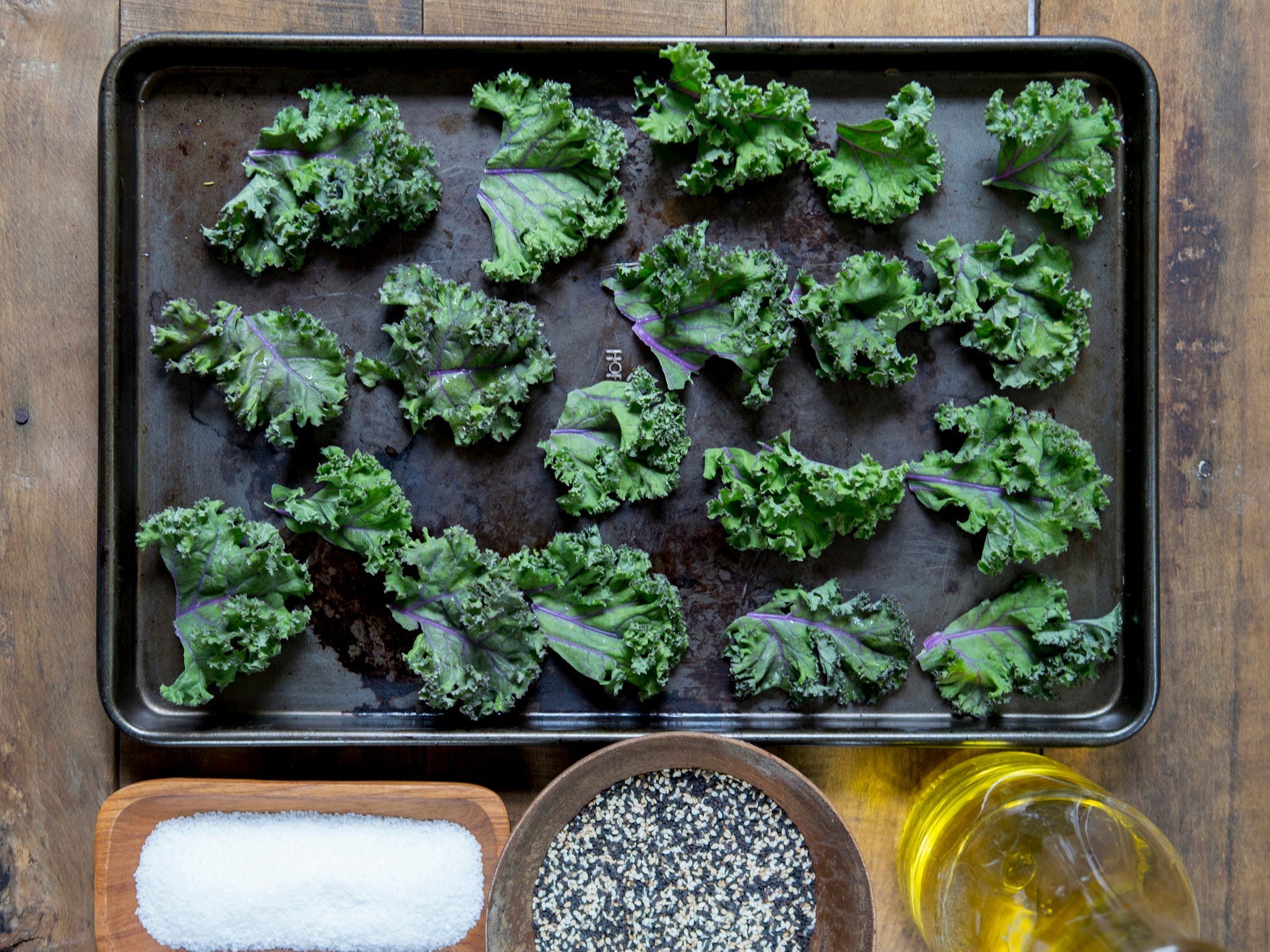 Kale chips being prepped for the oven