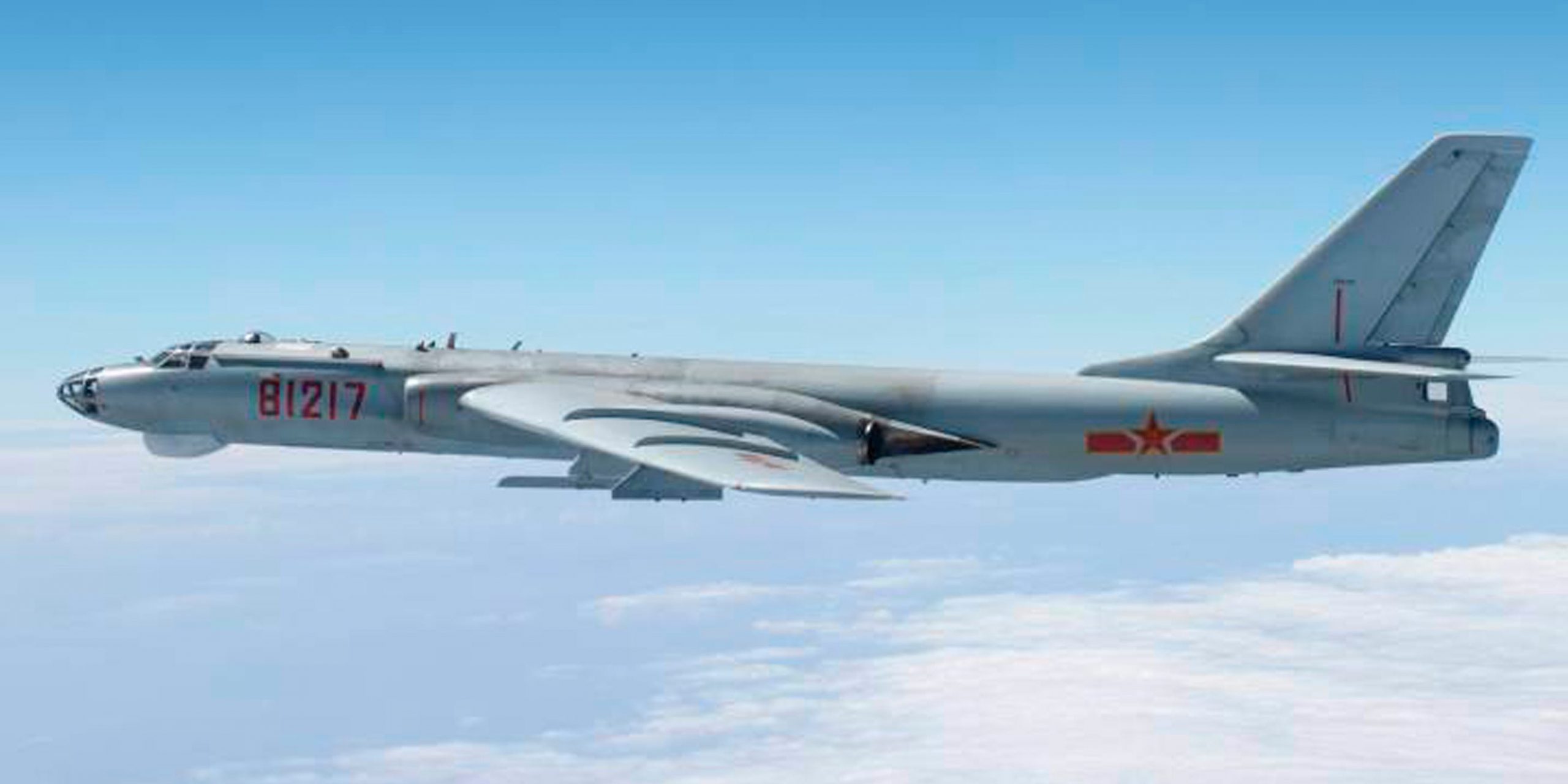 A Chinese military plane H-6 bomber flies through airspace between Okinawa prefecture's main island and the smaller Miyako island in southern Japan, out over the Pacific