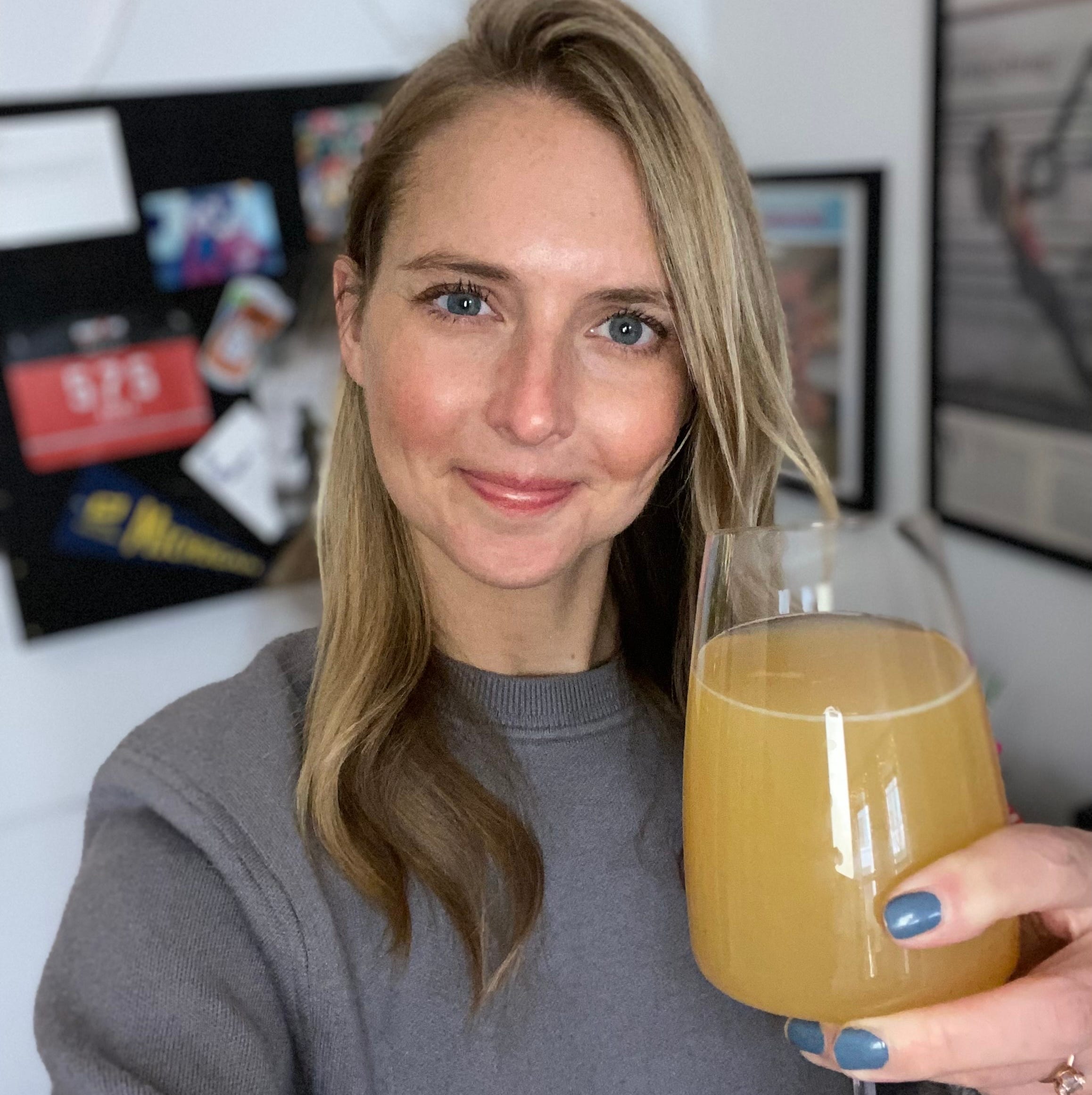 Anna Medaris with a beer in her home.