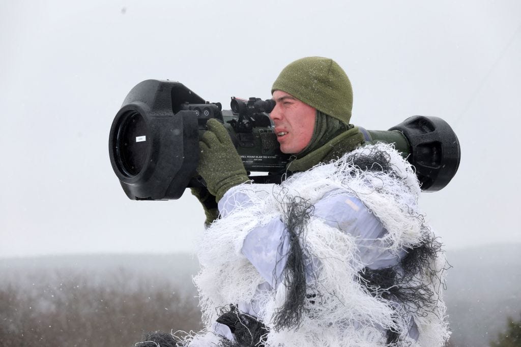 A Ukrainian Military Forces serviceman aims with a Next generation Light Anti-tank Weapon (NLAW) Swedish-British anti-aircraft missile launcher during a drill at the firing ground of the International Center for Peacekeeping and Security, near the western Ukrainian city of Lviv on January 28, 2022