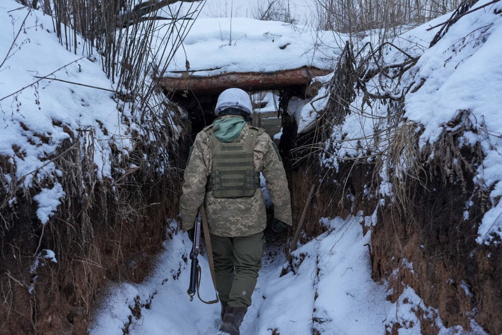 Ukrainian soldiers patrol the trenches along the frontline near the town of Zolote-4, Ukraine on January 19, 2022.