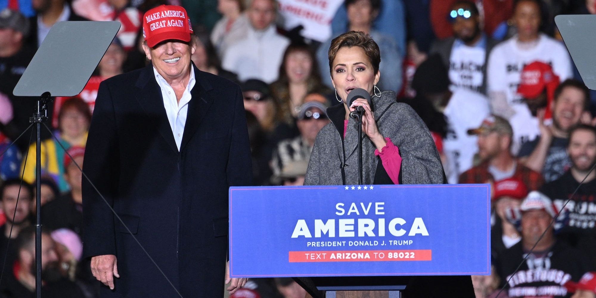 Former US President Donald Trump and Kari Lake, whom Trump is supporting in the Arizona's gubernatorial race, speak during a rally at the Canyon Moon Ranch festival grounds in Florence, Arizona, southeast of Phoenix, on January 15, 2022, - Thousands of Donald Trump supporters gathered in Arizona on Saturday to hear a raft of speakers claim the 2020 US election was stolen,