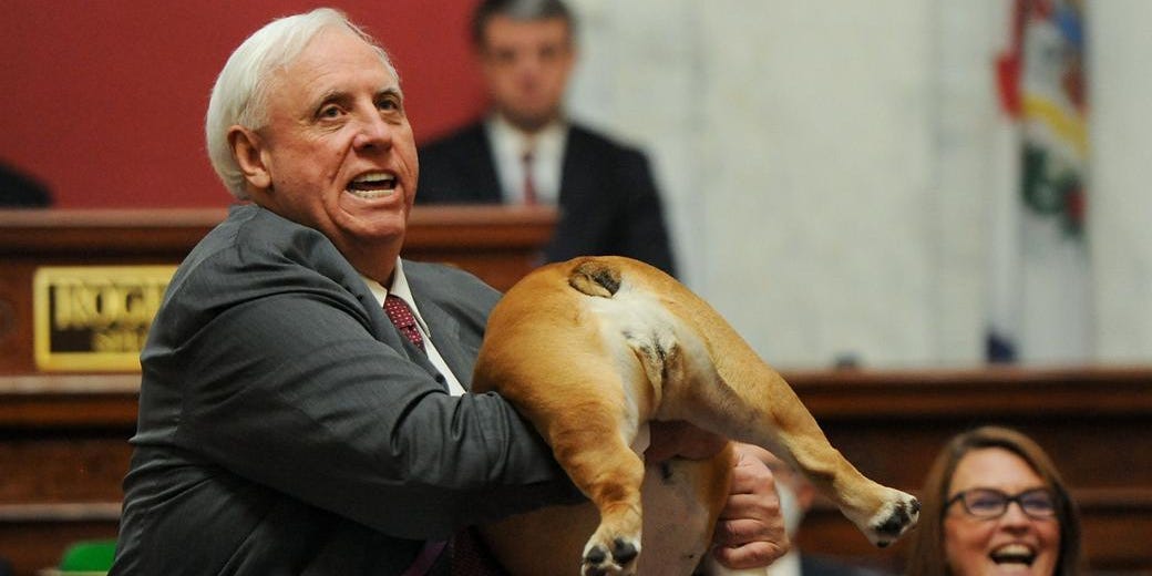 West Virginia Gov. Jim Justice (R) and Babydog, his pet bulldog.