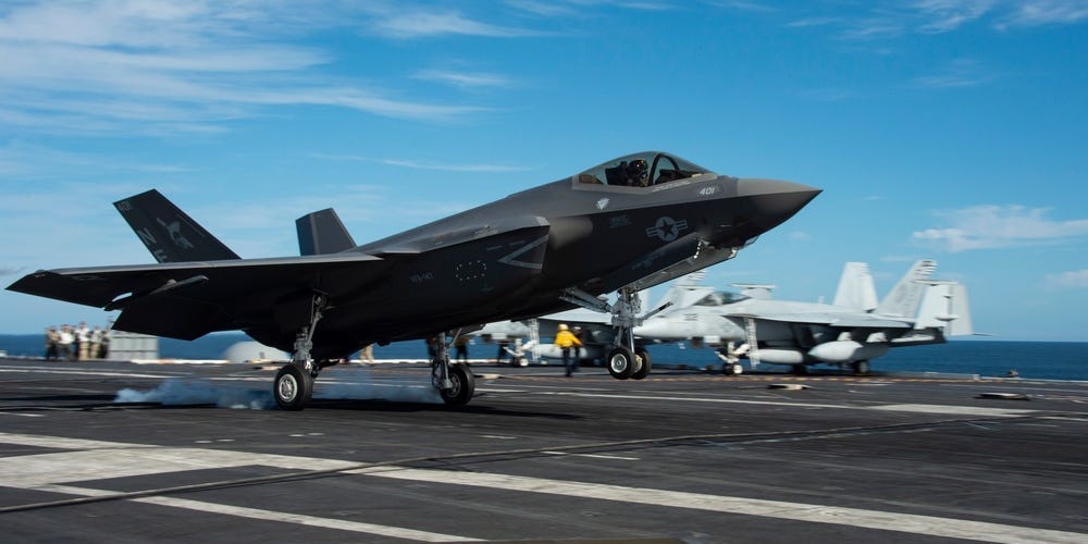 An F-35C Lightning II from Strike Fighter Squadron (VFA) 147 lands on the flight deck of Nimitz-class nuclear aircraft carrier USS Carl Vinson (CVN 70)