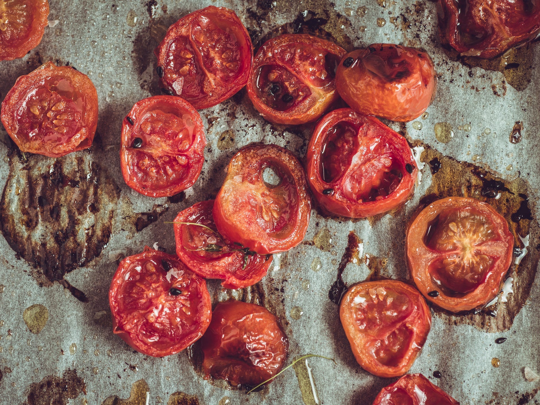 close up of roasted tomatoes on parchment