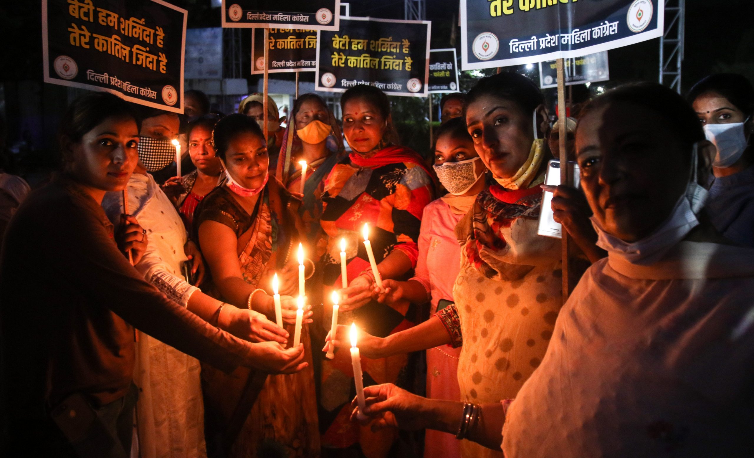 Women light candles during a protest over the rape and murder of a 21-year-old woman in New Delhi, India on September 6, 2021.