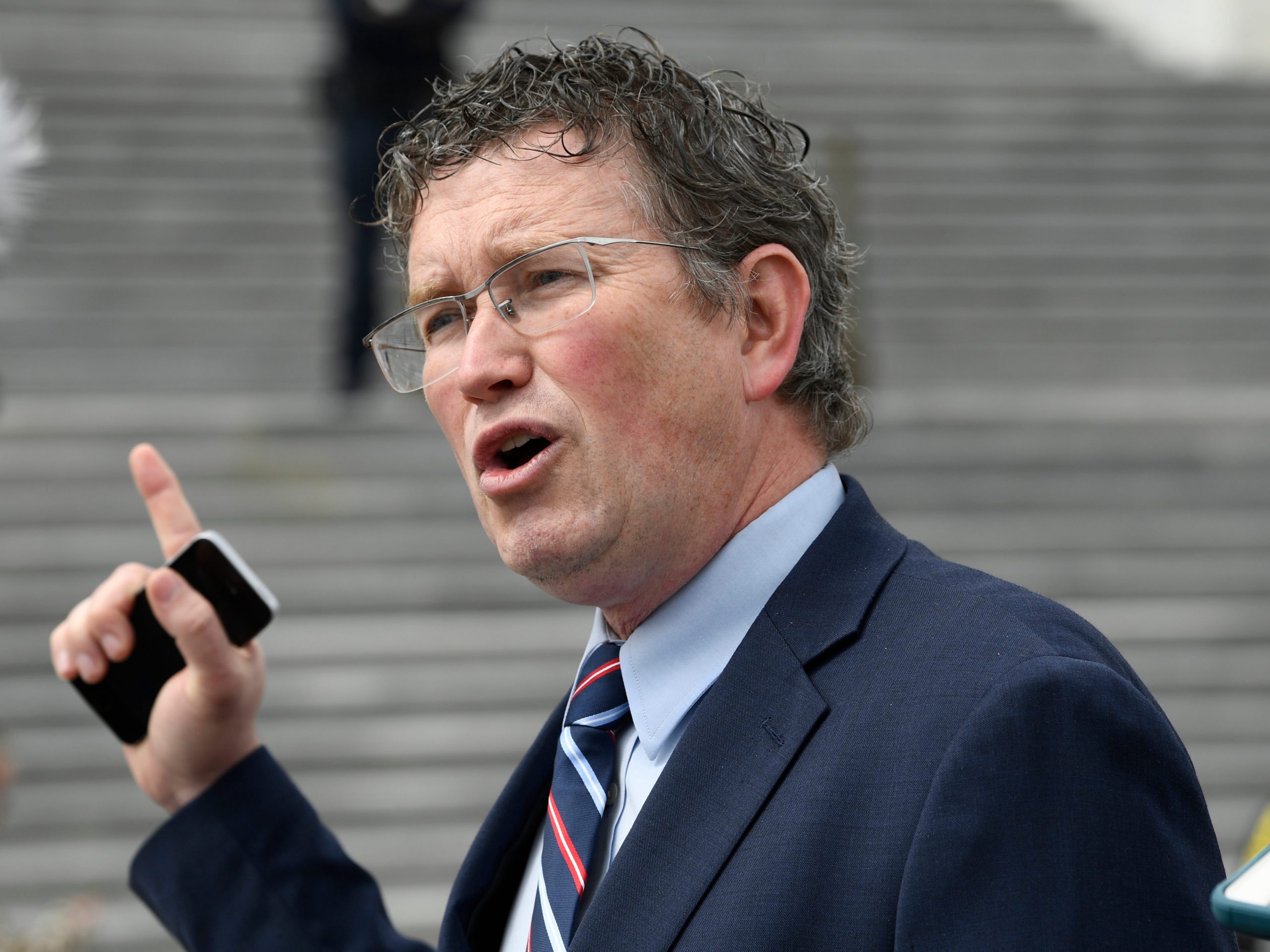 Rep. Thomas Massie, R-Ky., talks to reporters before leaving Capitol Hill in Washington, Friday, March 27, 2020, after attempting to slow action on a rescue package.