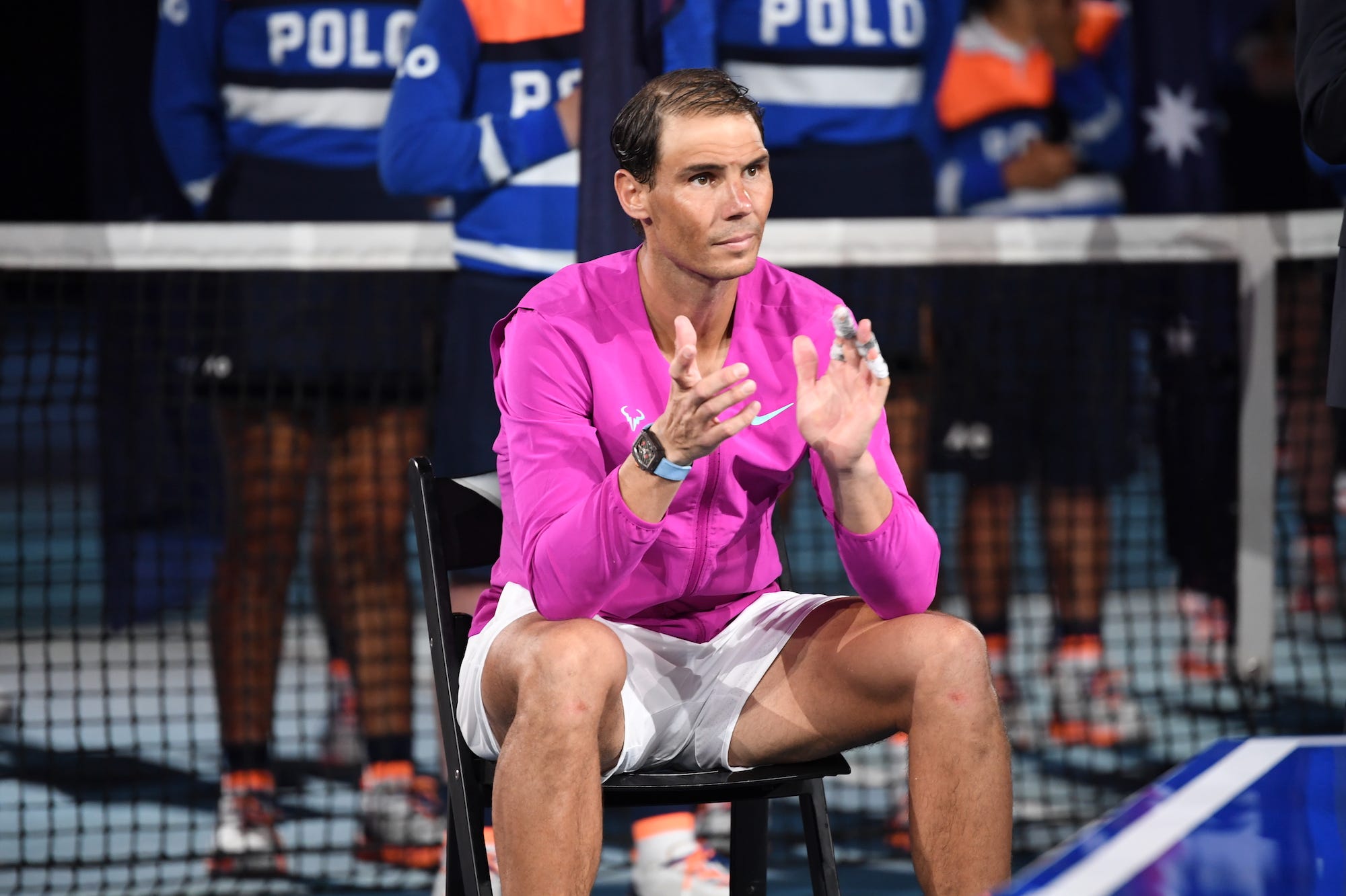 Rafael Nadal of Spain sits in a chair on court as he awaits the trophy presentation after winning in his Men’s Singles Final match against Daniil Medvedev of Russia during day 14 of the 2022 Australian Open at Melbourne Park