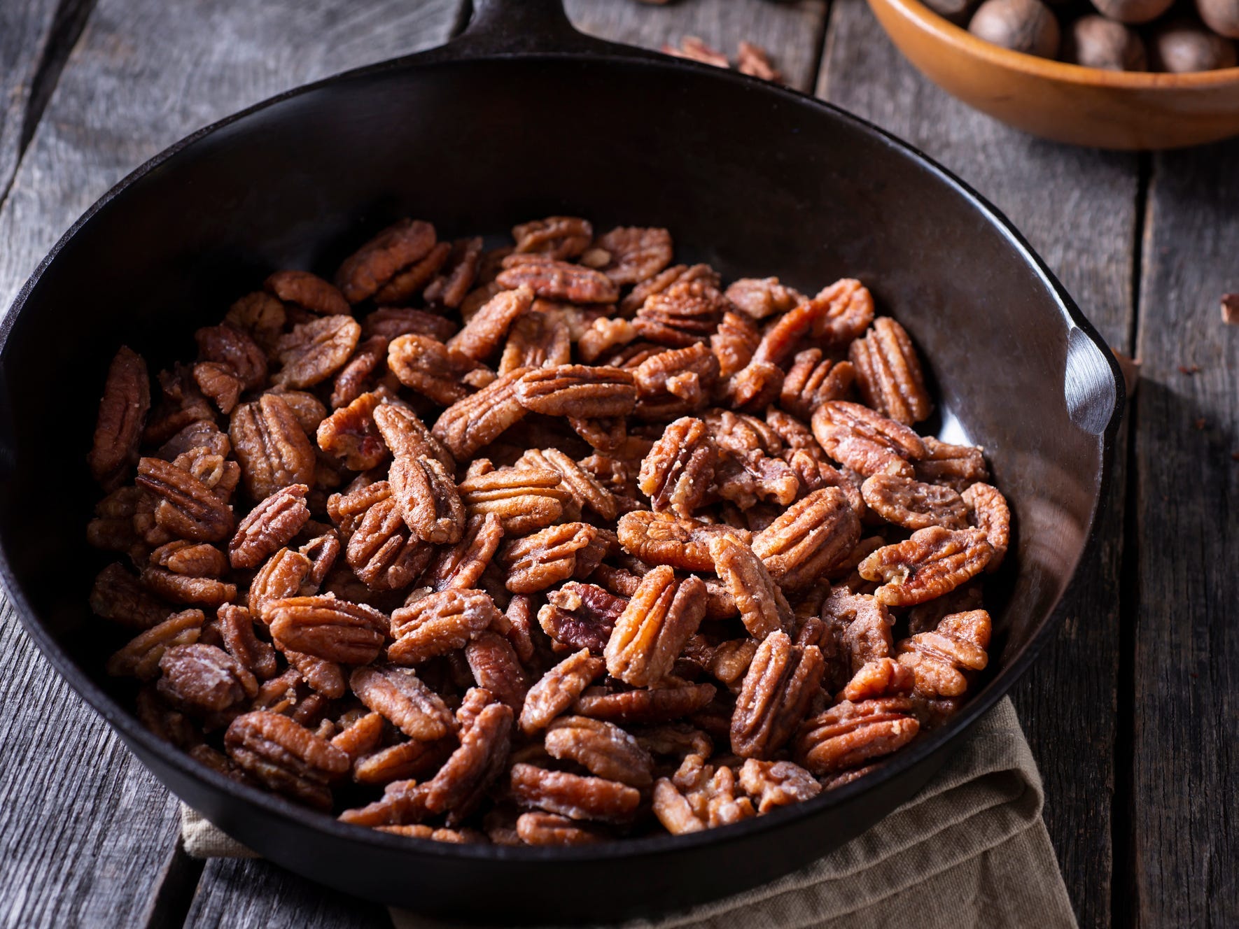 Candied pecans in a skillet