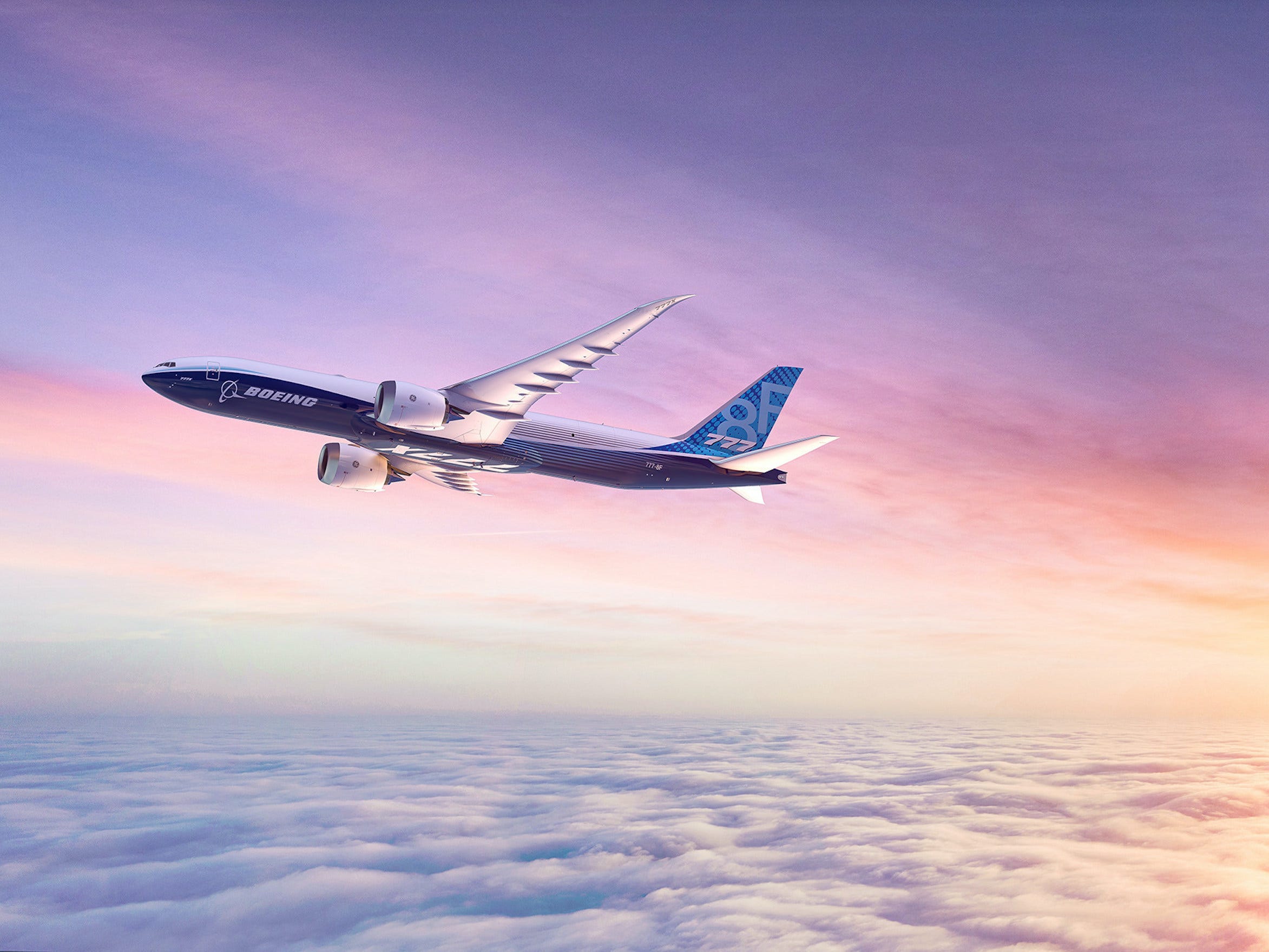 A rendering of the Boeing 777-8 Freighter in the sky at sunset.