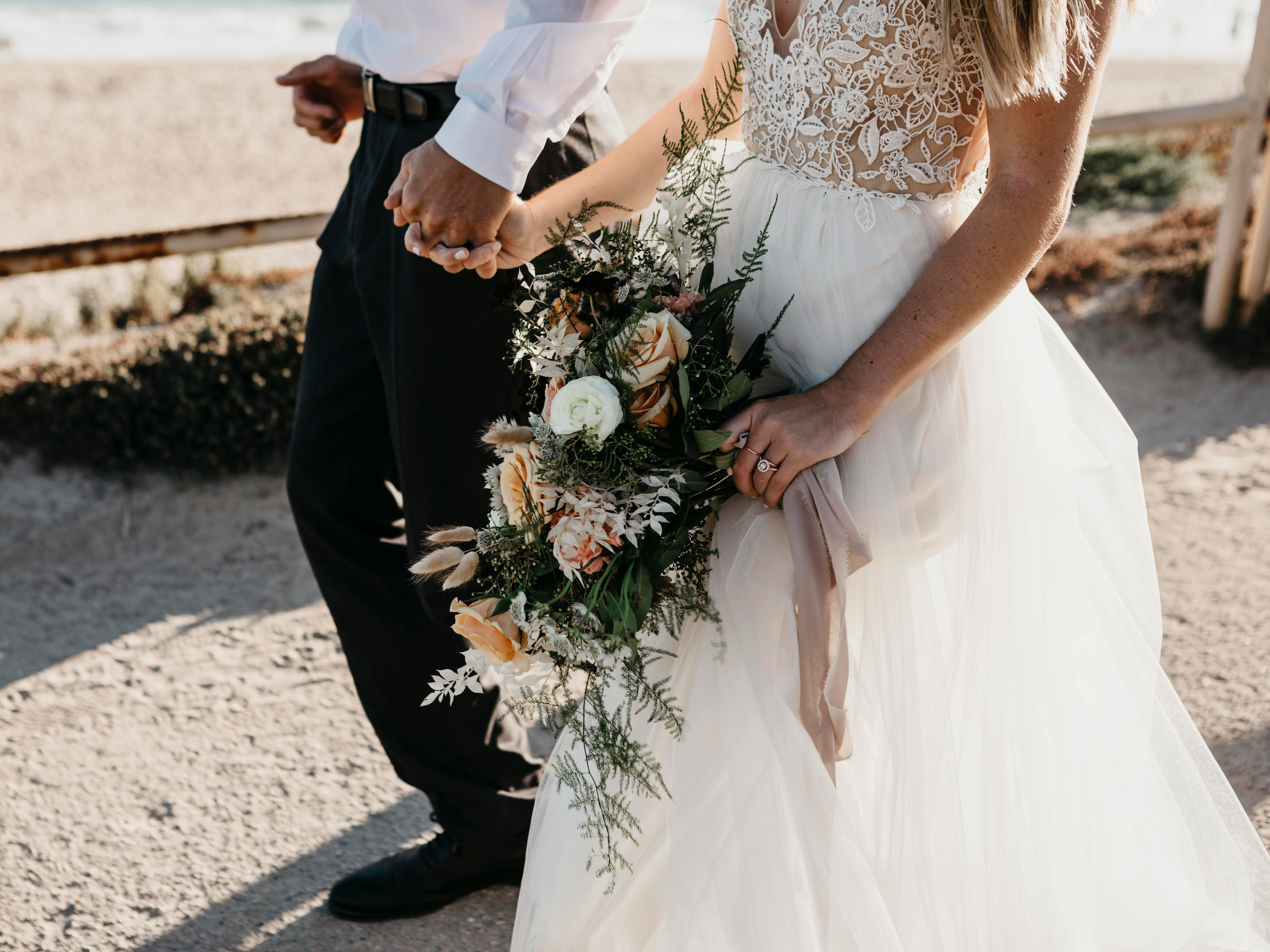 bride groom walking bouquet