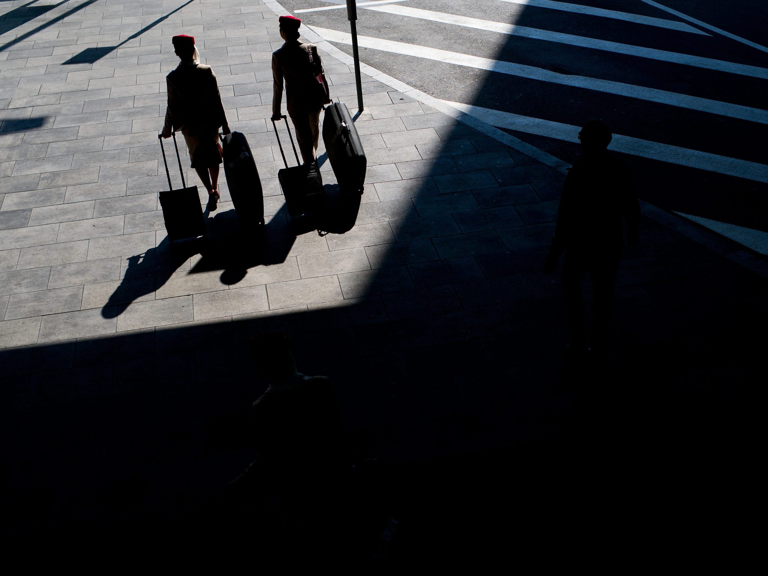Emirates flight attendants leave the Barcelona - El Prat Airport on February 24, 2013 in Barcelona, Spain.