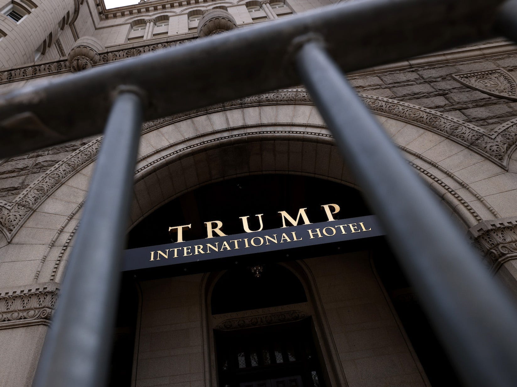 The Trump International Hotel is seen though security fencing on June 02, 2021 in Washington, DC.